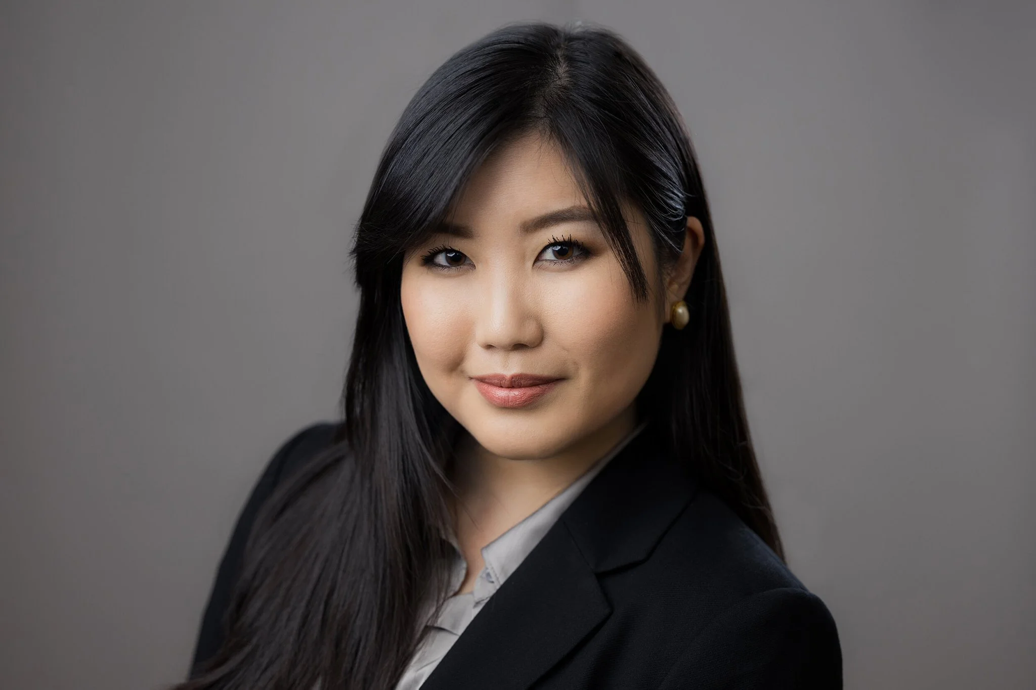 Light Grey Background Woman Busines Portrait.jpeg