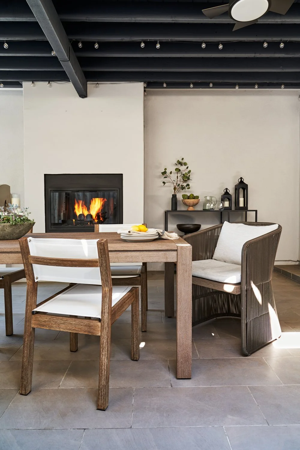 Outdoor living in Studio City. Indoor outdoor room includes covered dining area with fireplace, bar area, perfect for entertaining. Los Angeles area interior designer. Top Los Angeles Interior Design
