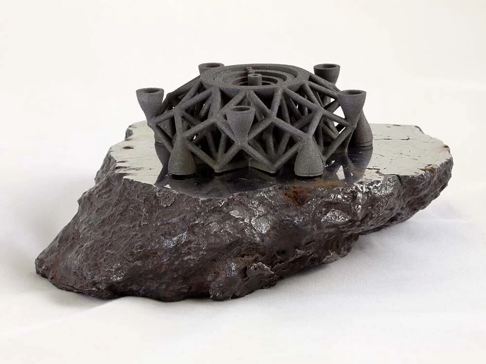 The first object ever 3D printed with meteorite metals. This photo was using in tech magazines and in an exhibit at the Museum of Flight.