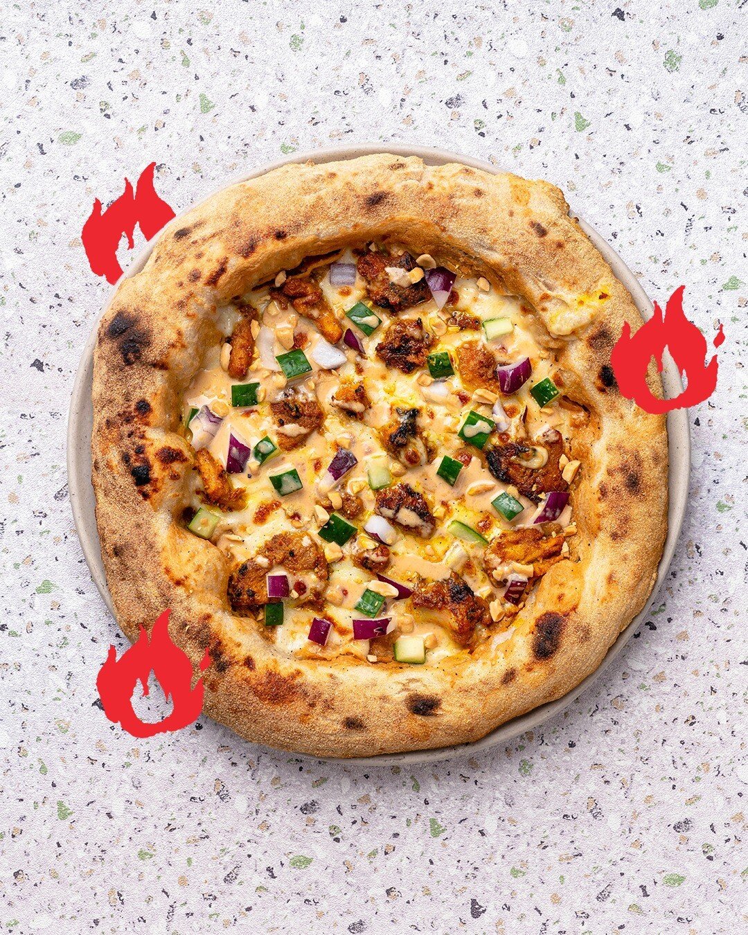 This May we&rsquo;re excited to introduce our latest Pizza of the Month &mdash; The Satay Pizza! Our signature sourdough crust loaded with chunks of chicken with a sweet &amp; spicy marinade, fresh cucumbers and house-pickled onions. Generously drizz