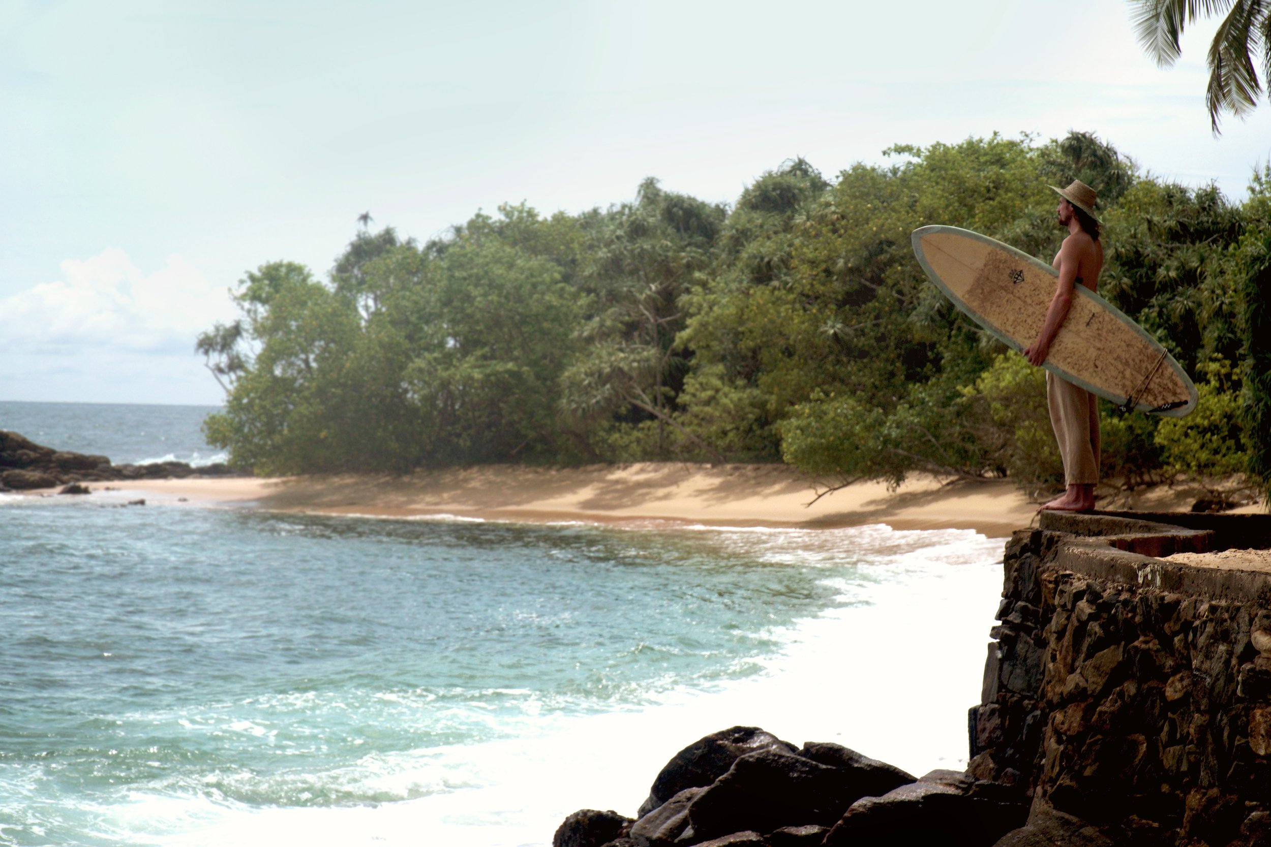 Checking the surf in the morning before a surf coaching session at into the blue sri lanka