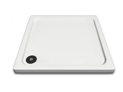 A white plastic shower tray with a black drain cover in the corner.