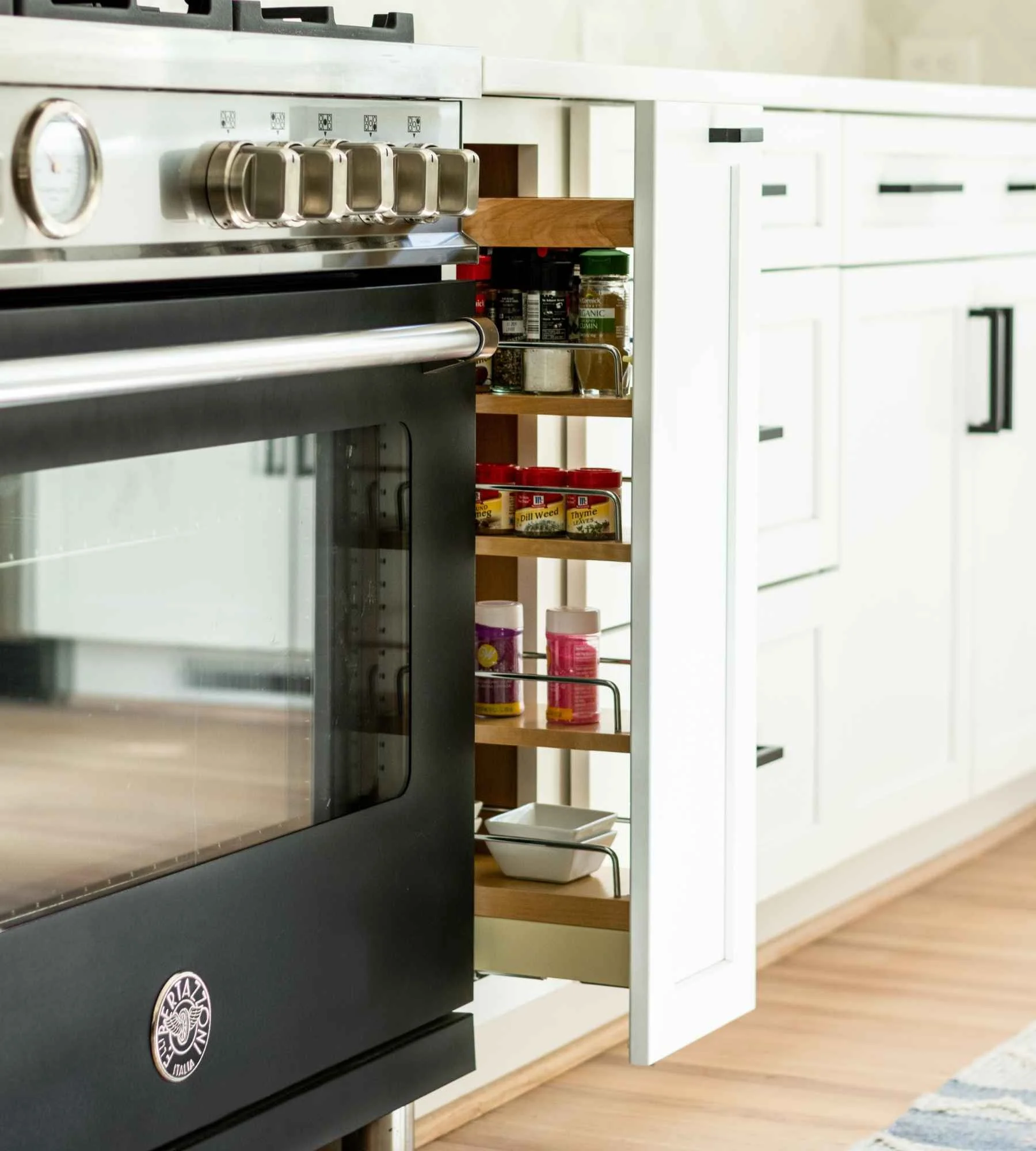 susan-hill-design-group-matthews-nc-designing-a-personalized-home-kitchen-cabinets-pull-out-spice-rack-next-to-oven-sophisticated-new-build-home.jpg