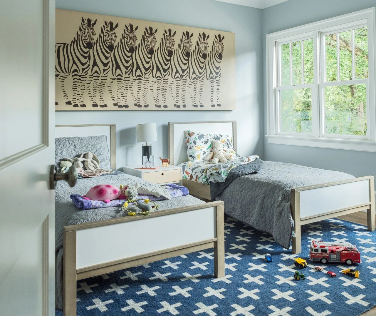 full-service-interior-design-charleston-sc-choosing-high-quality-rugs-kids-bedroom-two-beds-zebra-art-blue-patterned-rug-transforming.jpg