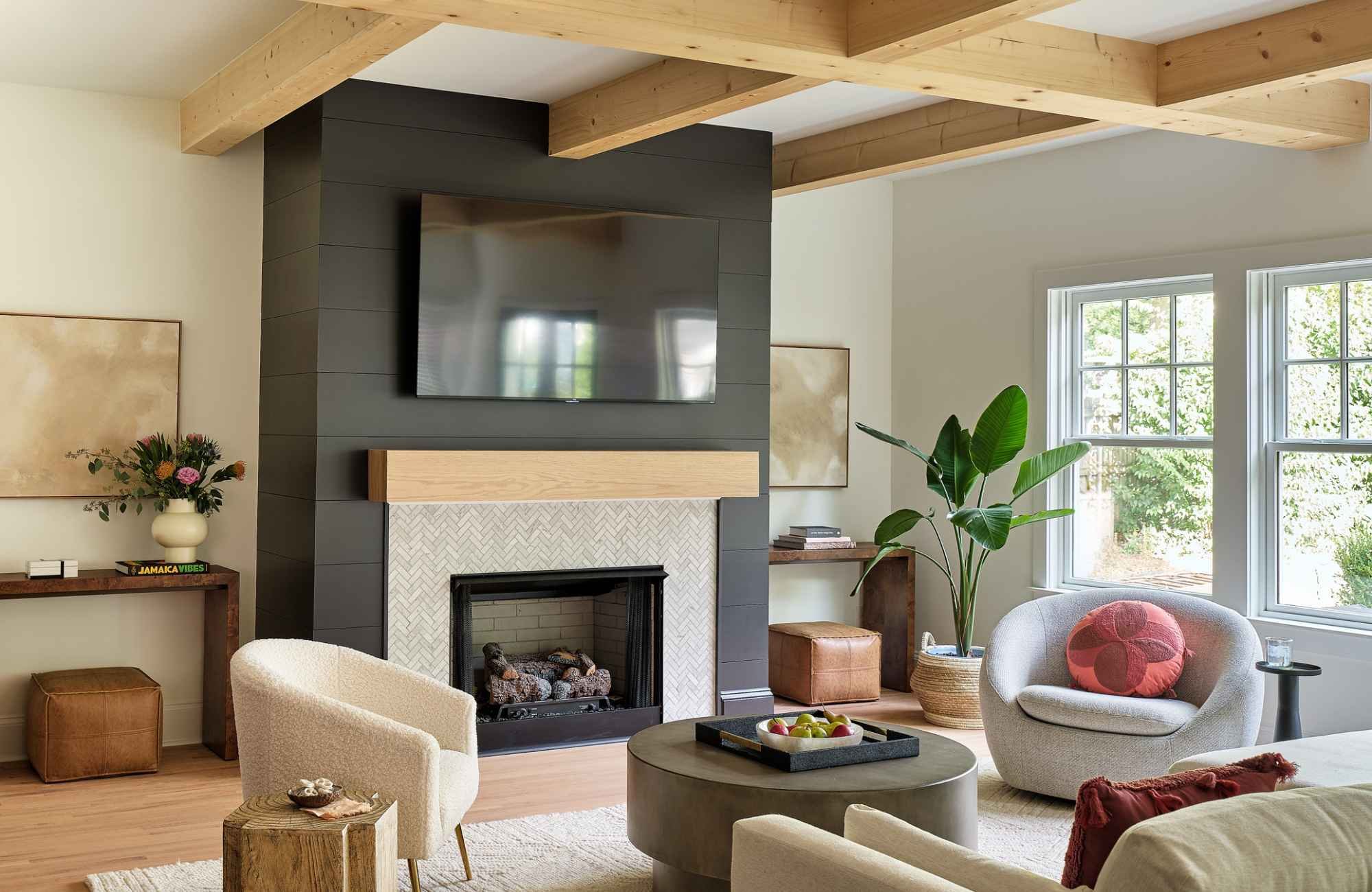 full-service-interior-design-lake-norman-nc-texture-in-neutral-interiors-living-room-with-dark-fireplace-feature-wood-ceiling-beams-turnkey.jpg