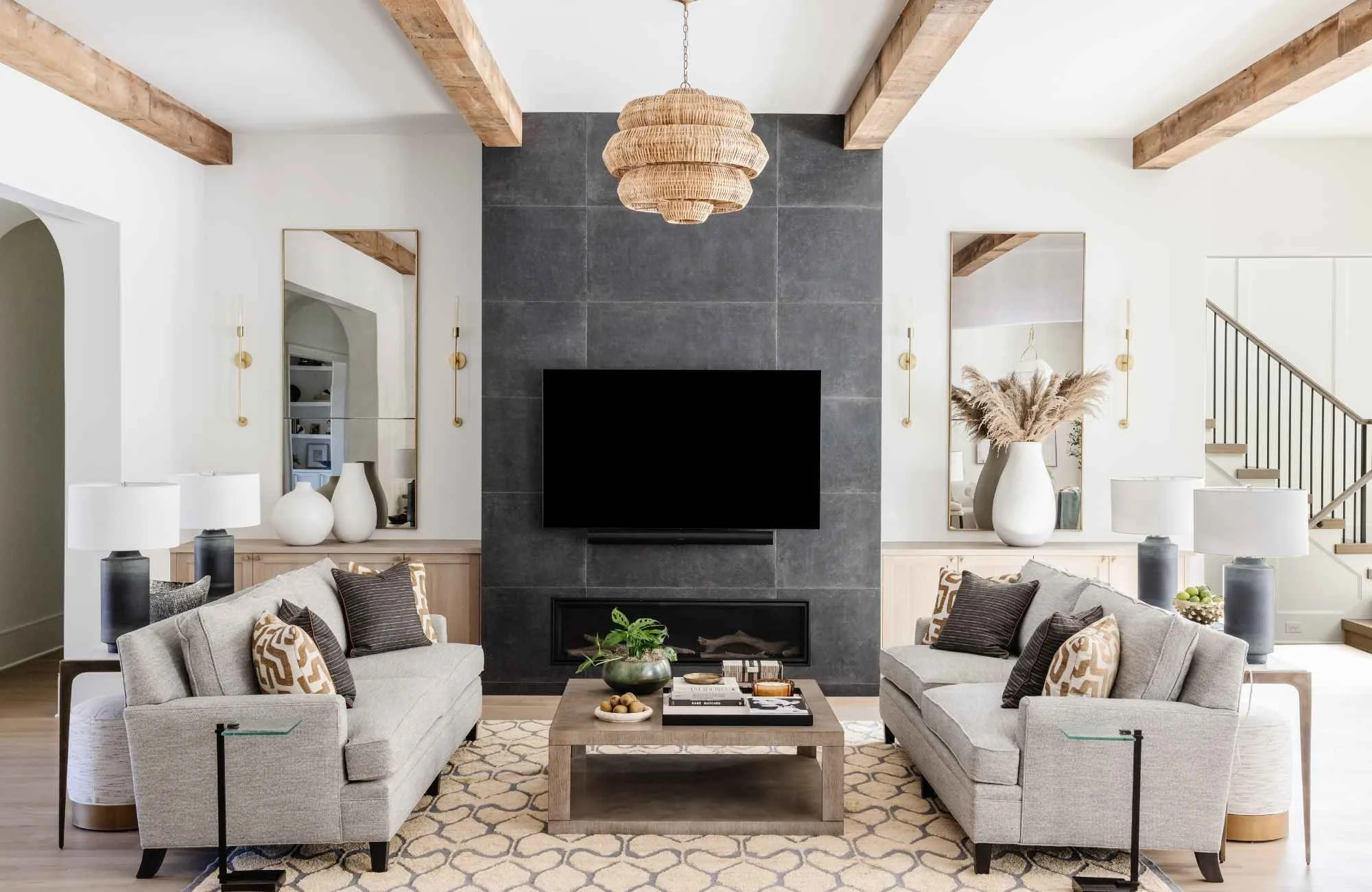susan-hill-design-group-columbia-sc-choosing-high-quality-rugs-living-room-with-two-sofas-large-fireplace-feature-wall-wood-ceiling-beams-timeless.jpg