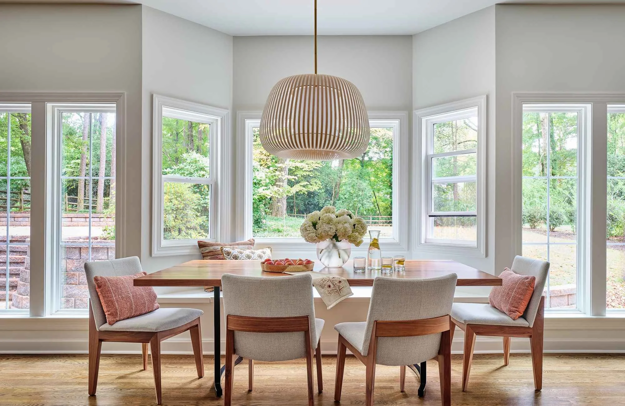 susan-hill-design-group-waxhaw-nc-scale-and-proportion-interior-design-dining-table-by-bay-window-large-light-fixture-sanctuary-home-renovation.jpg