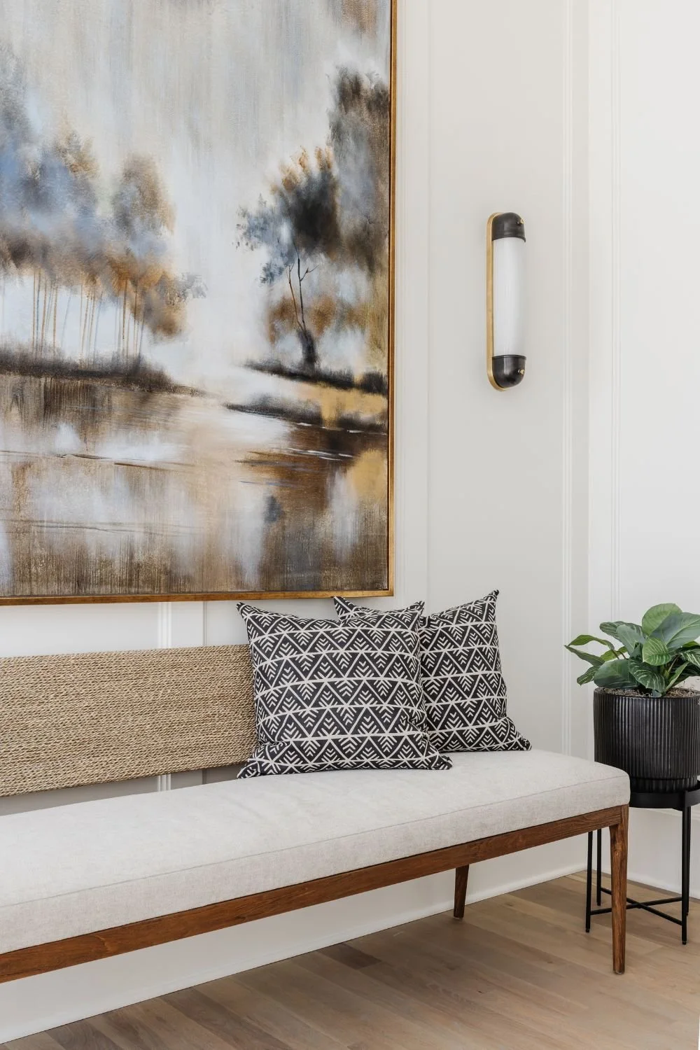 full-service-interior-design-huntersville-nc-layered-lighting-design-long-upholstered-bench-under-large-painting-wall-sconce-comfort-custom-home.jpg