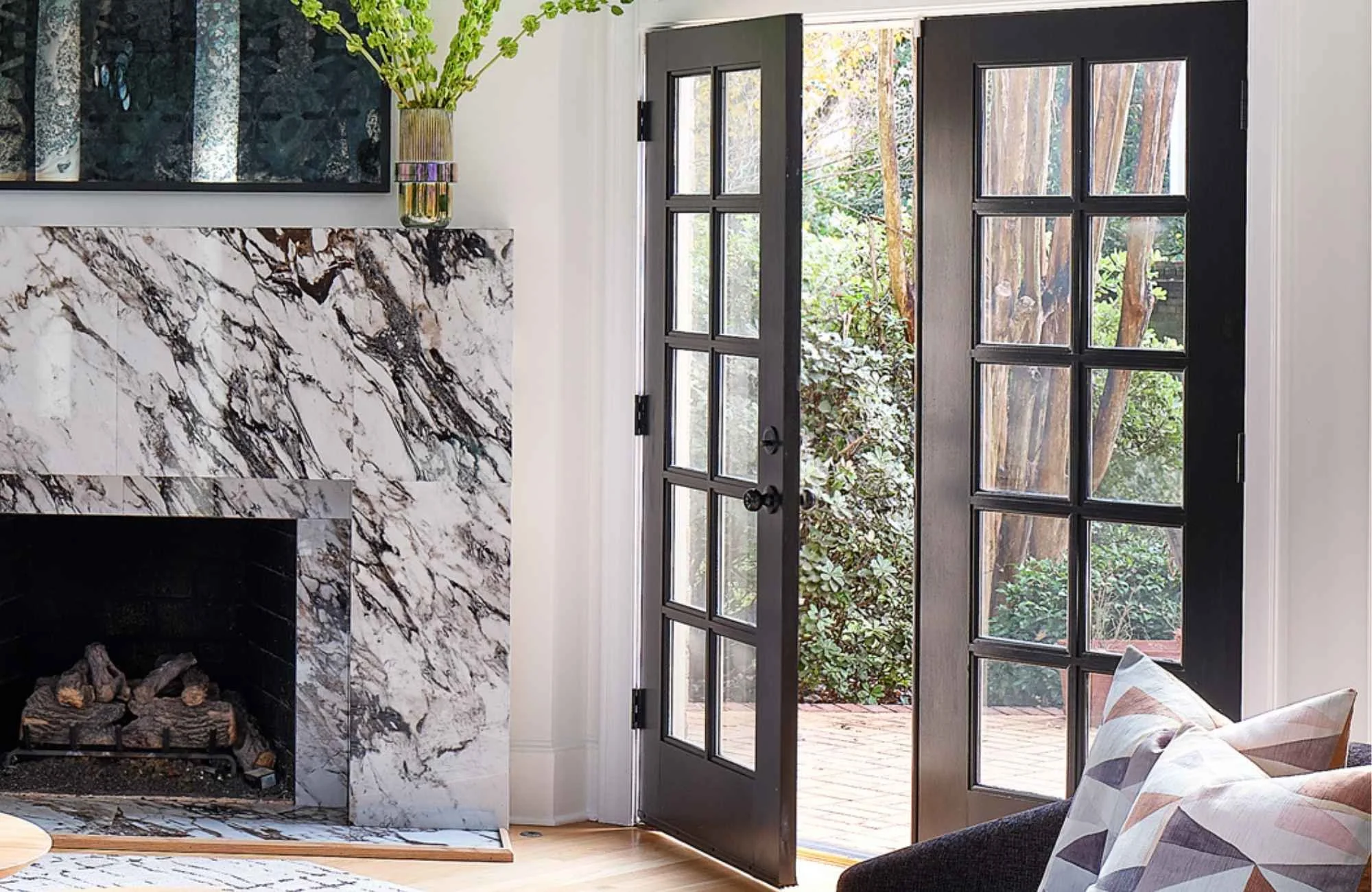 construction-management-ballantyne-nc-interior-door-hardware-styles-french-doors-opening-from-living-room-to-outdoors-marble-fireplace-surround-family-life-custom.jpg