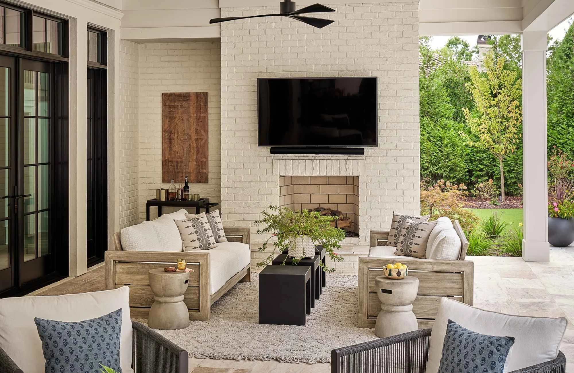susan-hill-design-group-charlotte-nc-interior-design-misconceptions-covered-outdoor-living-area-fireplace-comfortable-seating-collected-home-renovation.jpg