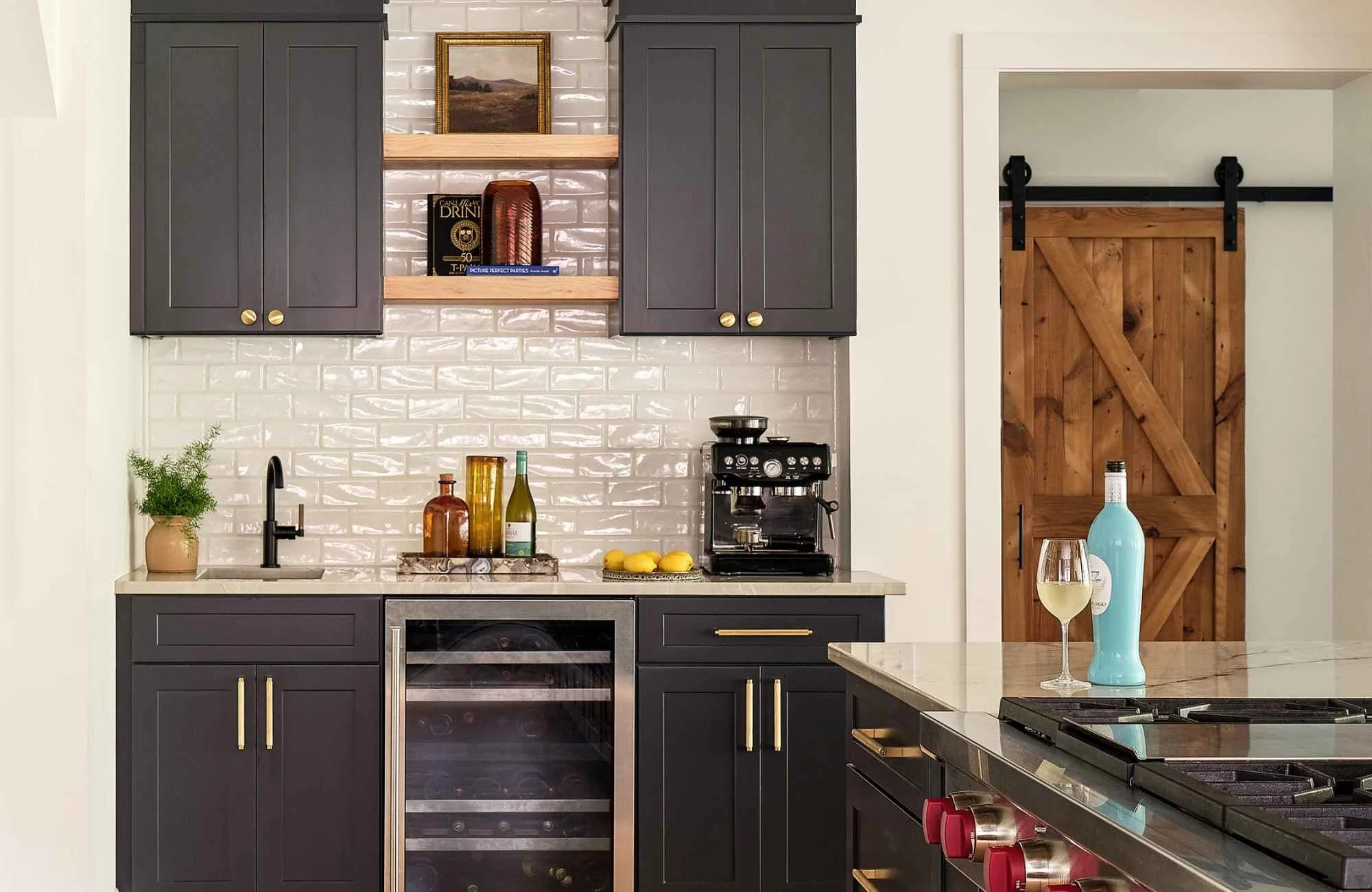 susan-hill-design-group-lake-norman-nc-kitchen-backsplash-options-navy-blue-cabinets-with-reflective-white-tile-luxury-appliances-everyday-practicality.jpg