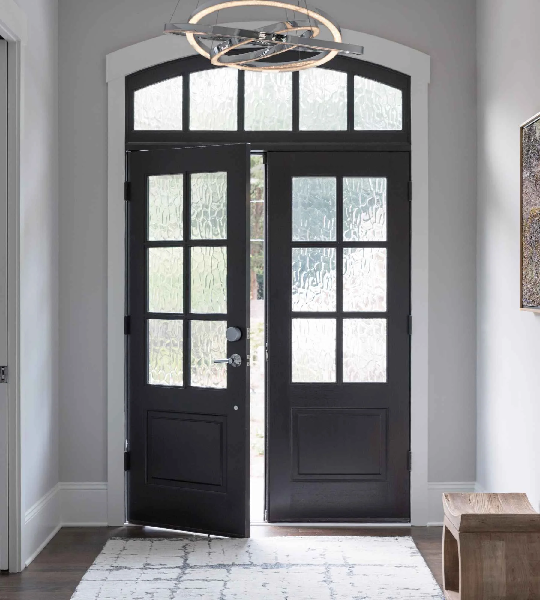 susan-hill-design-group-charlotte-nc-interior-door-hardware-styles-front-double-door-with-transom-black-modern-style-clean-new-build.jpg