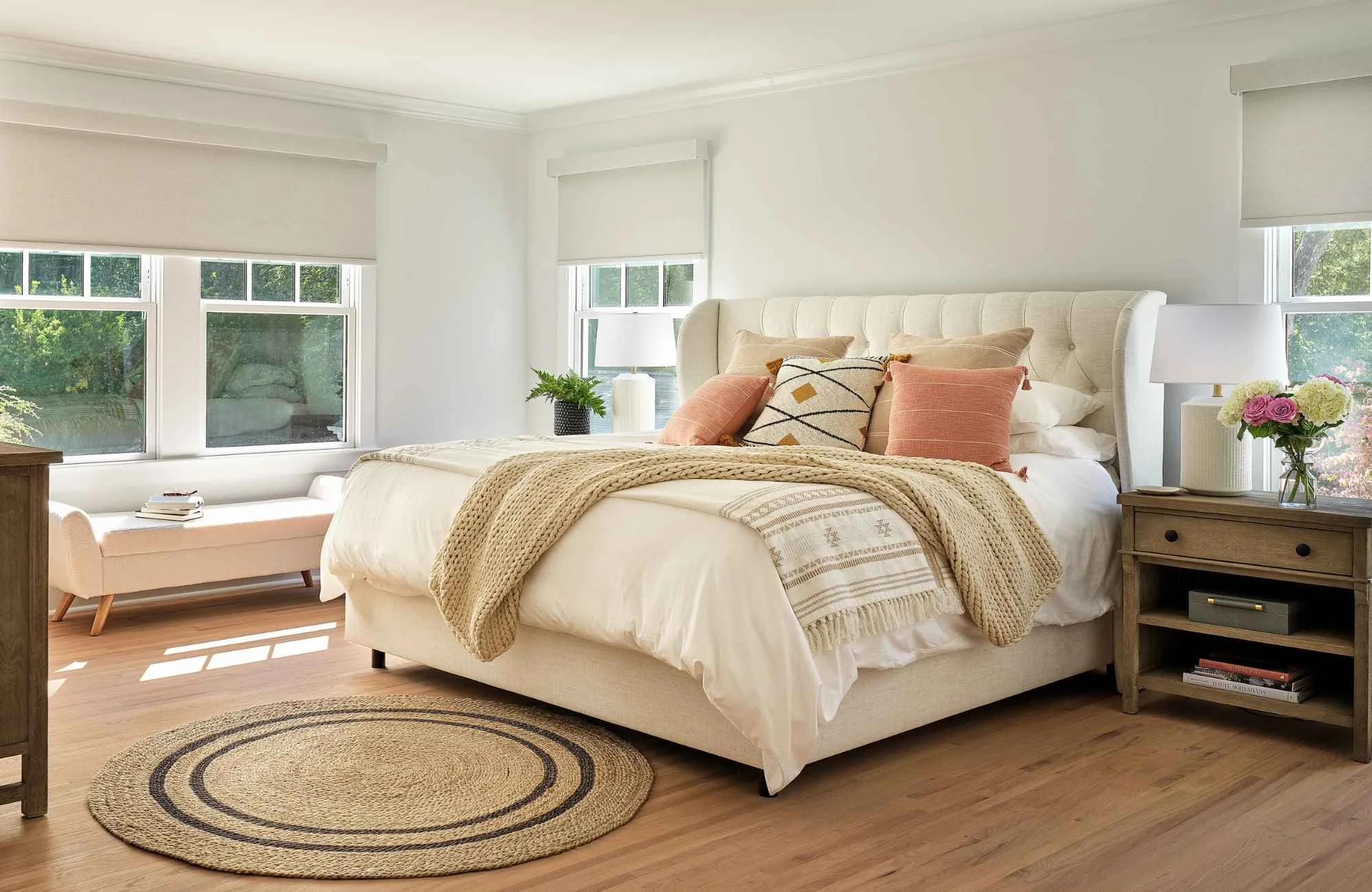 full-service-interior-design-mint-hill-nc-texture-in-neutral-interiors-comfortable-bedroom-with-round-natural-rug-wood-floor-timeless-new-build.jpg