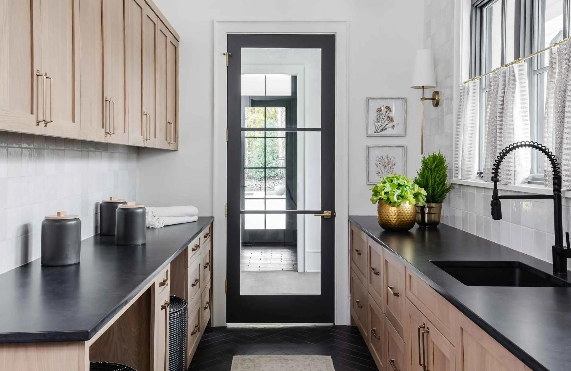 full-service-interior-designer-tega-cay-sc-interior-door-hardware-styles-glass-door-separating-galley-kitchen-dark-countertops-stained-wood-cabinets-comfort-design.jpg