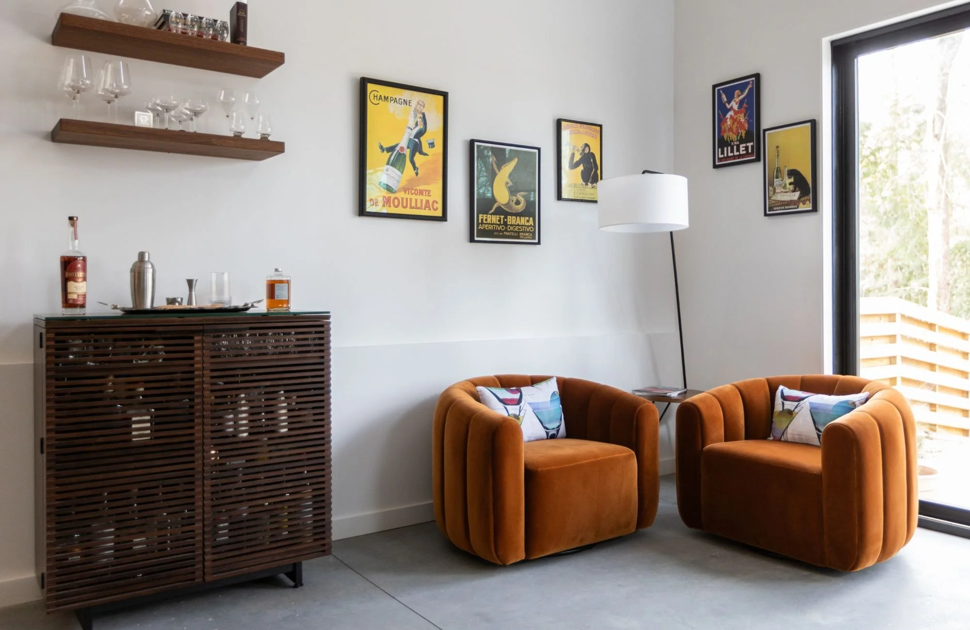 full-service-interior-design-ballantyne-nc-layered-lighting-design-burnt-orange-chairs-by-sliding-door-bar-cabinet-open-shelves-connection-new-build.jpg