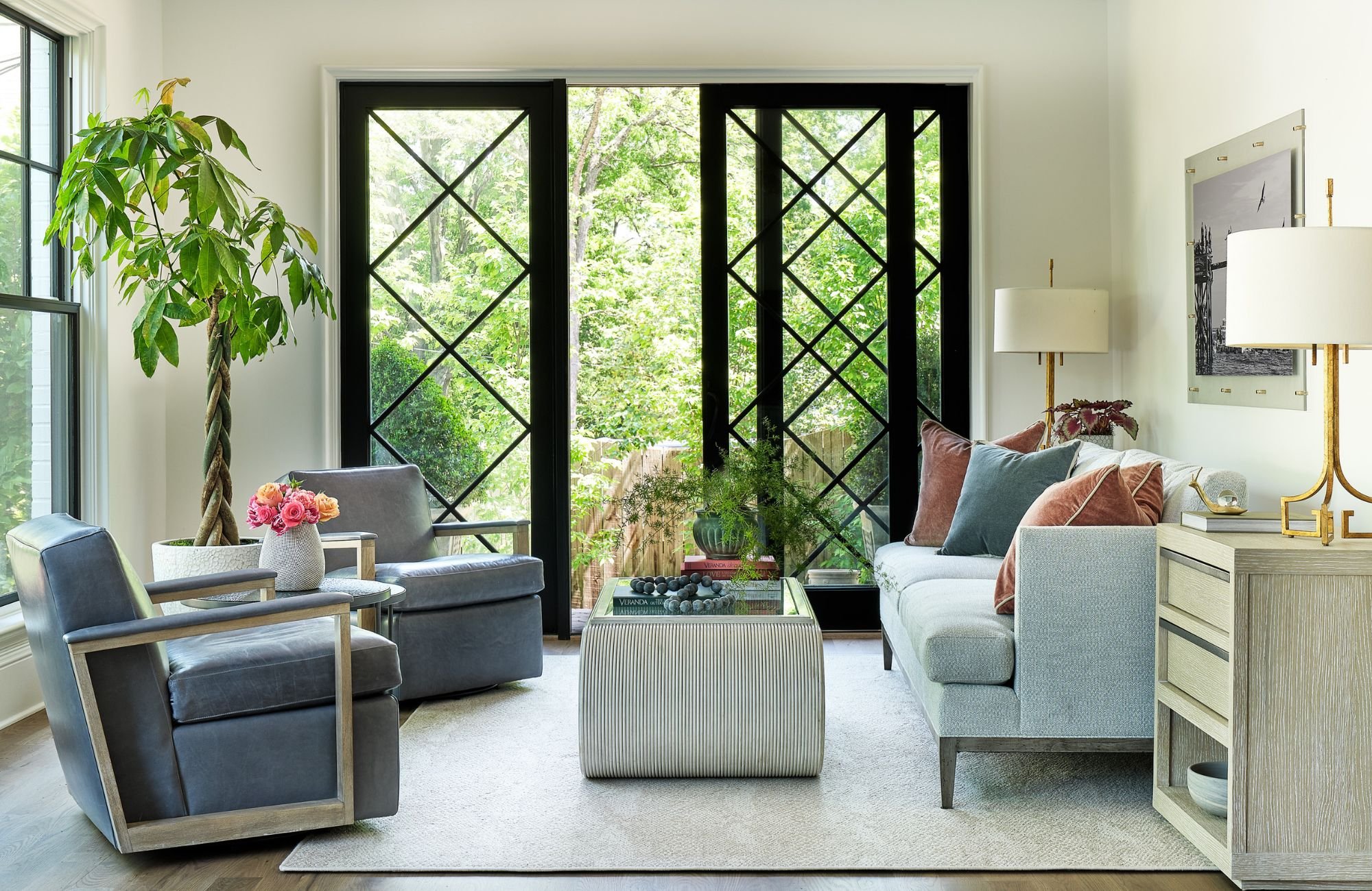 susan-hill-design-group-waxhaw-nc-home-design-for-entertaining-colorful-sitting-room-with-black-framed-french-doors-indoor-plant-custom-furniture-sanctuary.jpg