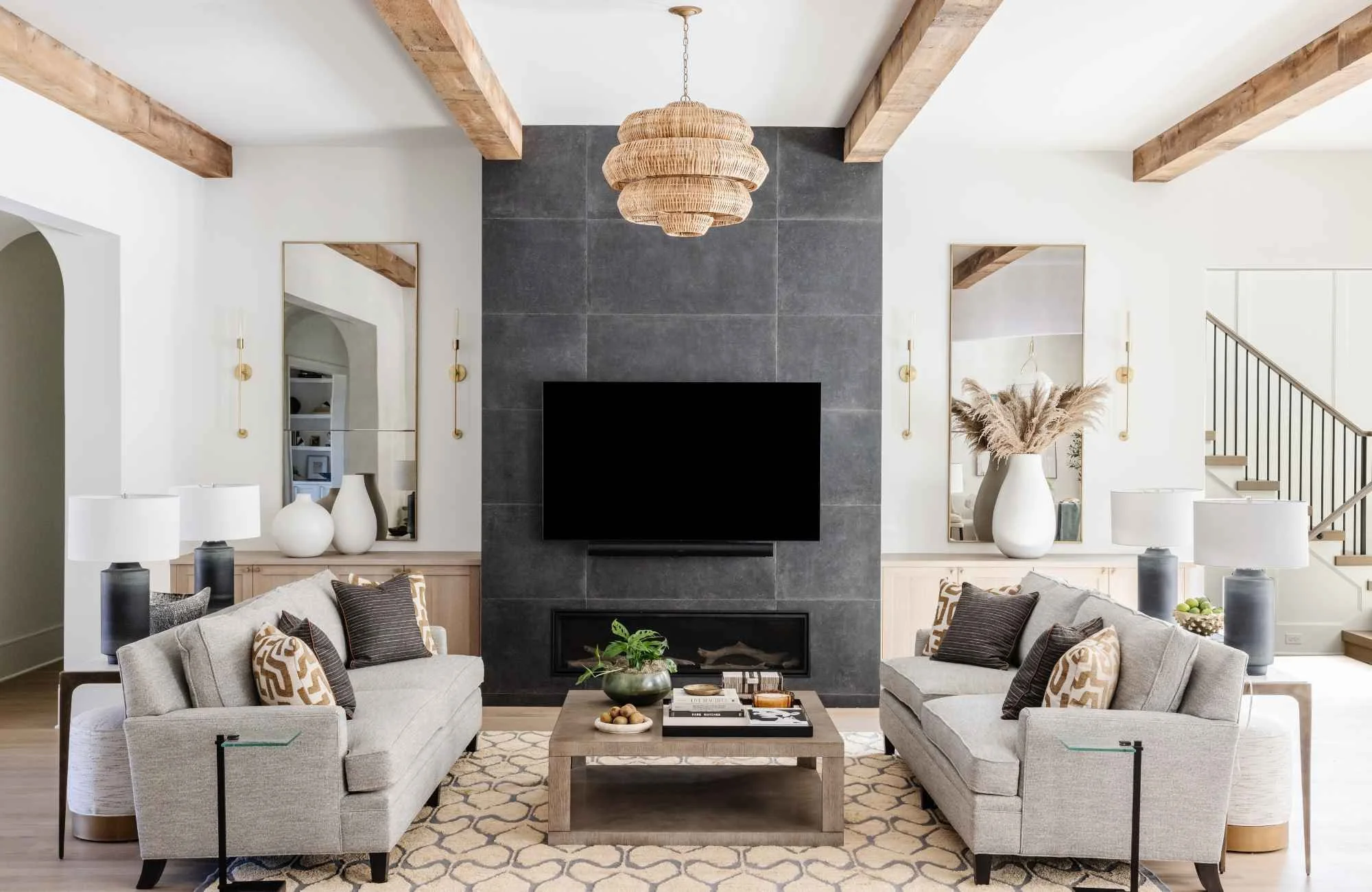 full-service-interior-designer-cornelius-nc-wood-accents-in-home-living-room-with-two-sofas-ceiling-beams-statement-light-fixture-turnkey-custom-homes.jpg