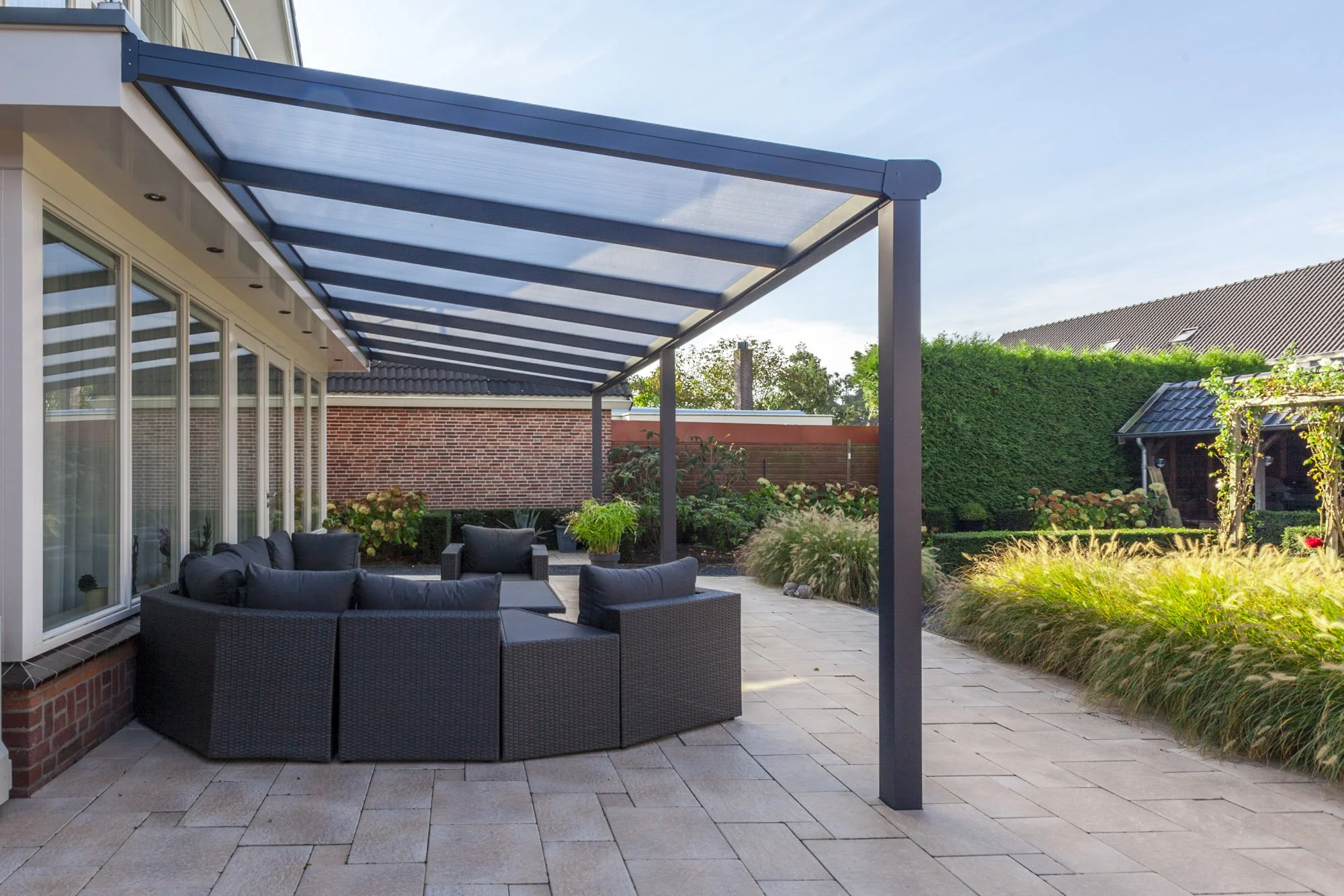 Contemporary aluminium veranda extending from rear of house.jpg