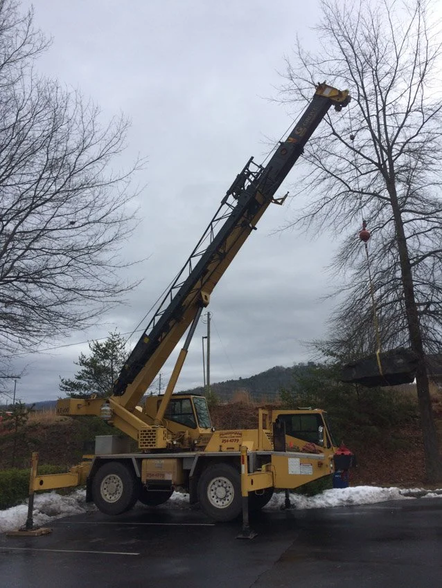 Swinging a boulder in for the Weaver Blvd sign