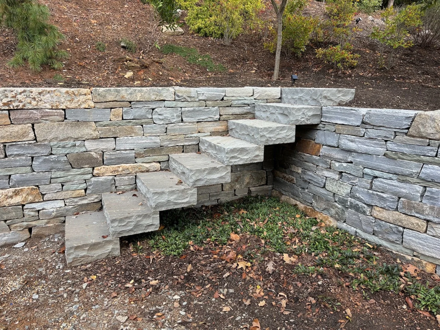 A stile staircase conveys people from the backyard up into the garden areas. Asheville