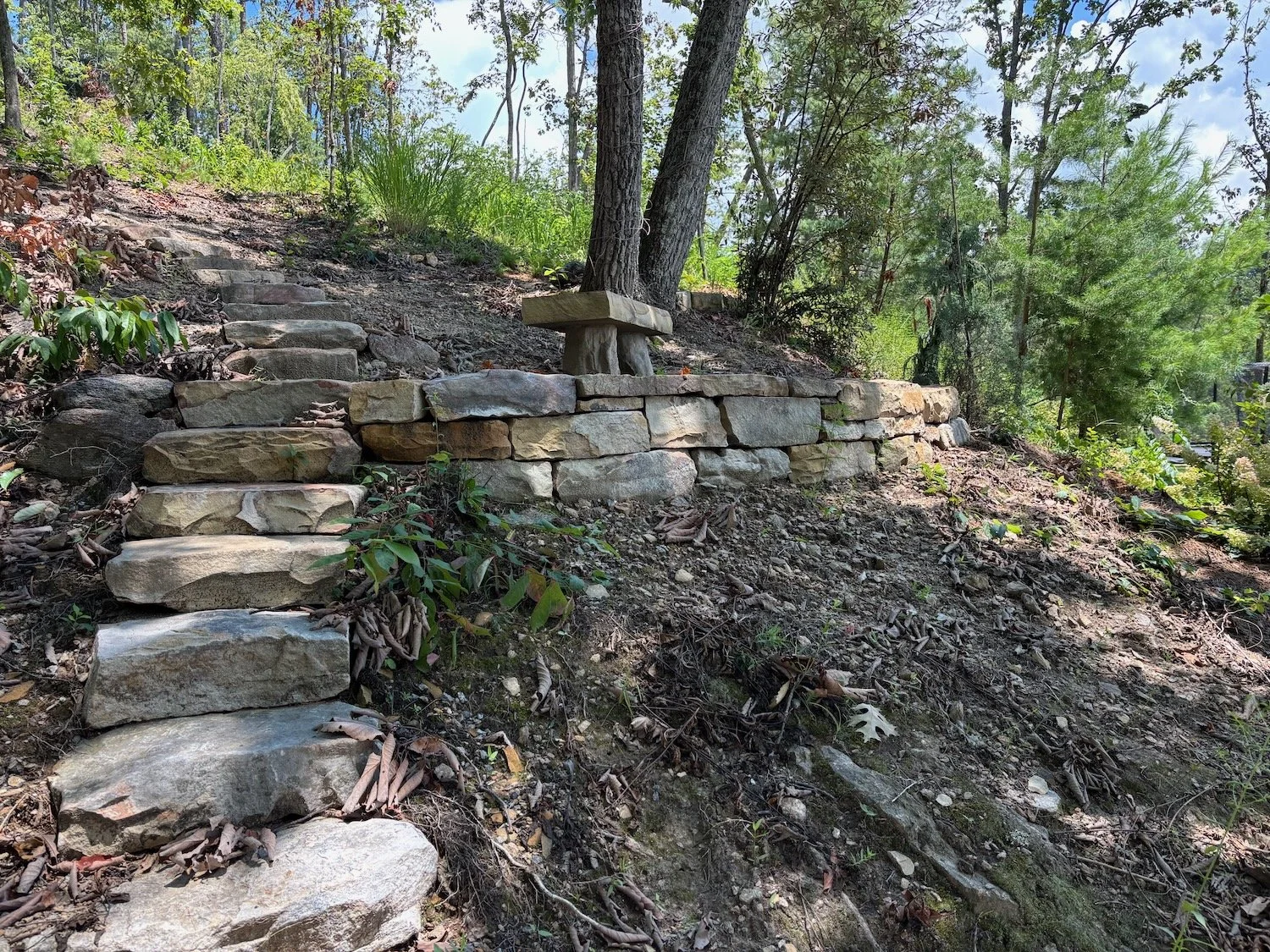 Boulder bench atop rugged crib wall, North Asheville