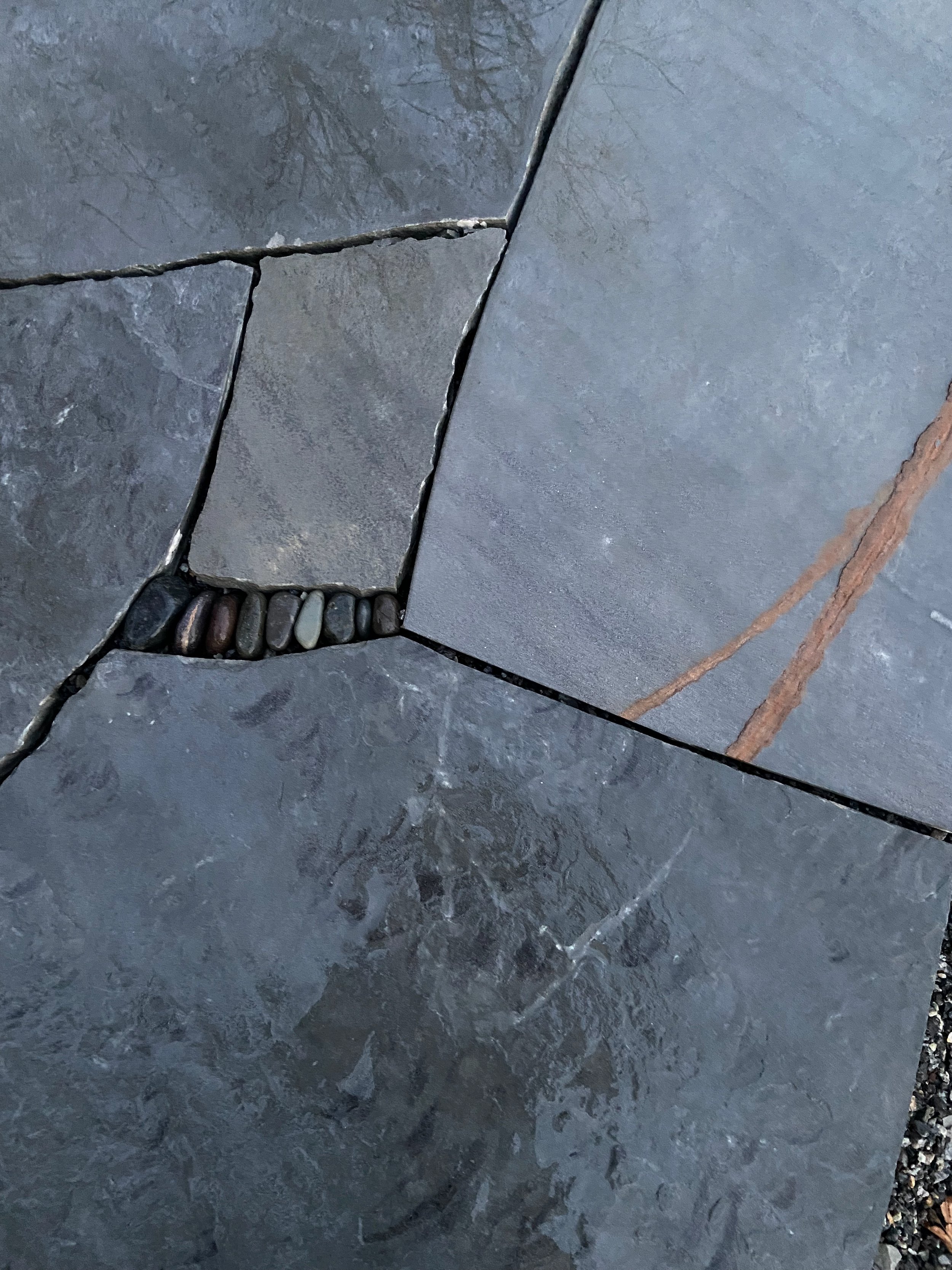Pebbles in patio joint