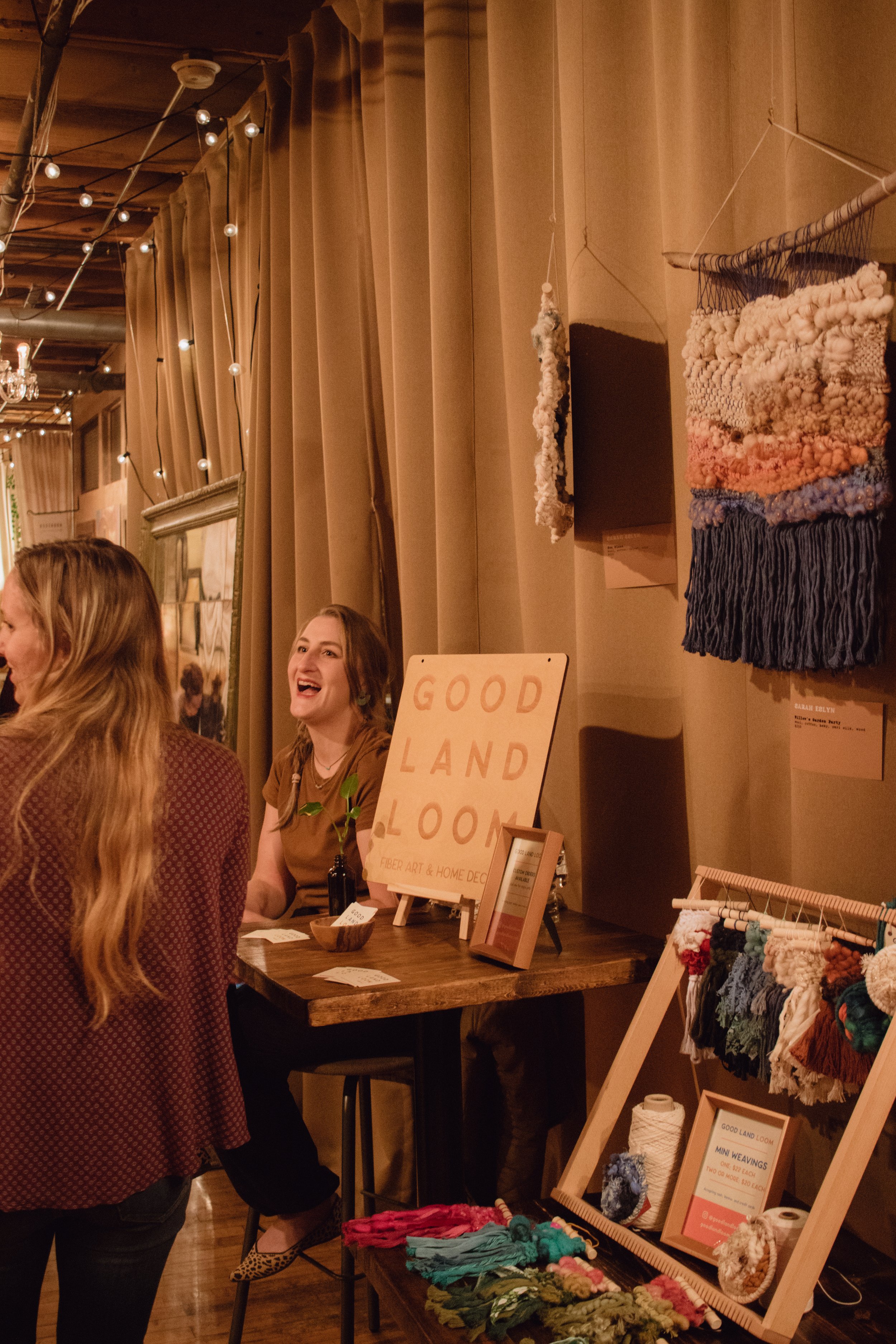  Weaving artist, Sarah Eslyn, of  Good Land Loom  laughing at Hygge: A Pop Up Gallery, curated by Milwaukee artist, Lauren Marie Nitka, at  Glassnote Candle Bar . 