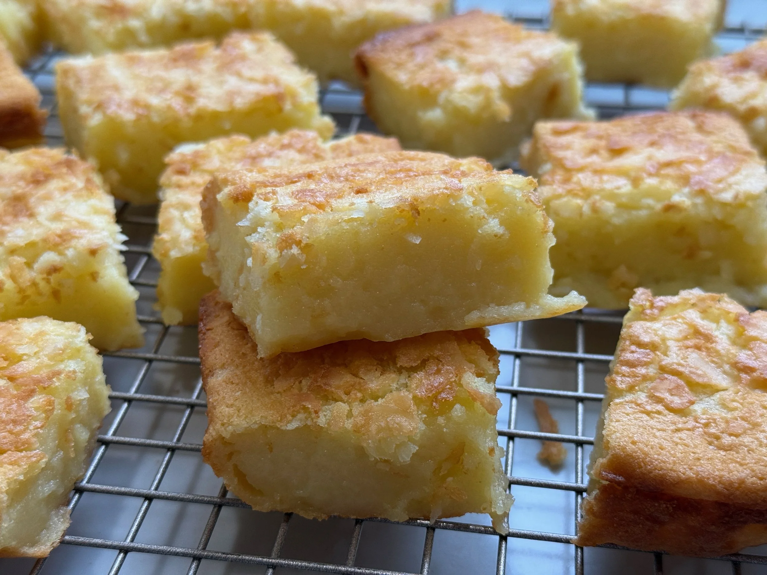 butter mochi laid out on wire rack