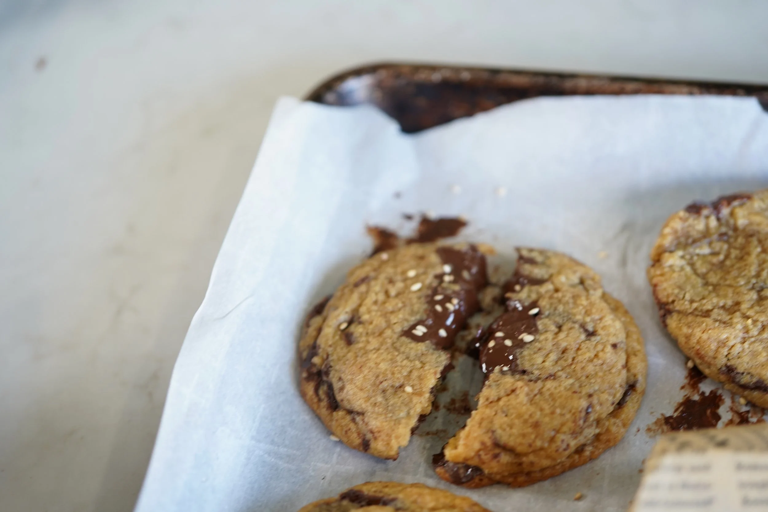 miso chocolate chip cookies laid out on baking sheet