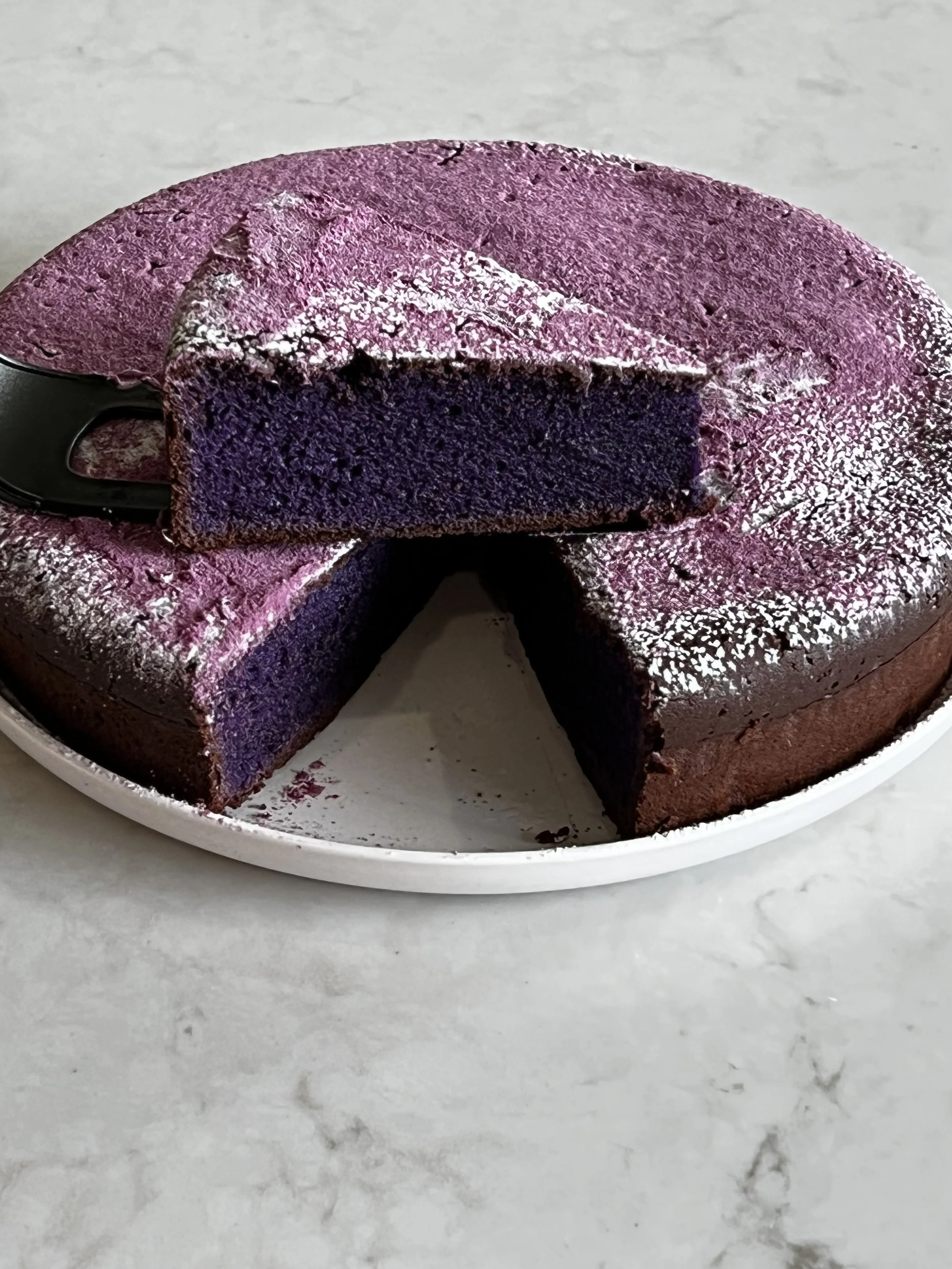 ube mochi cake sliced and cross section shown