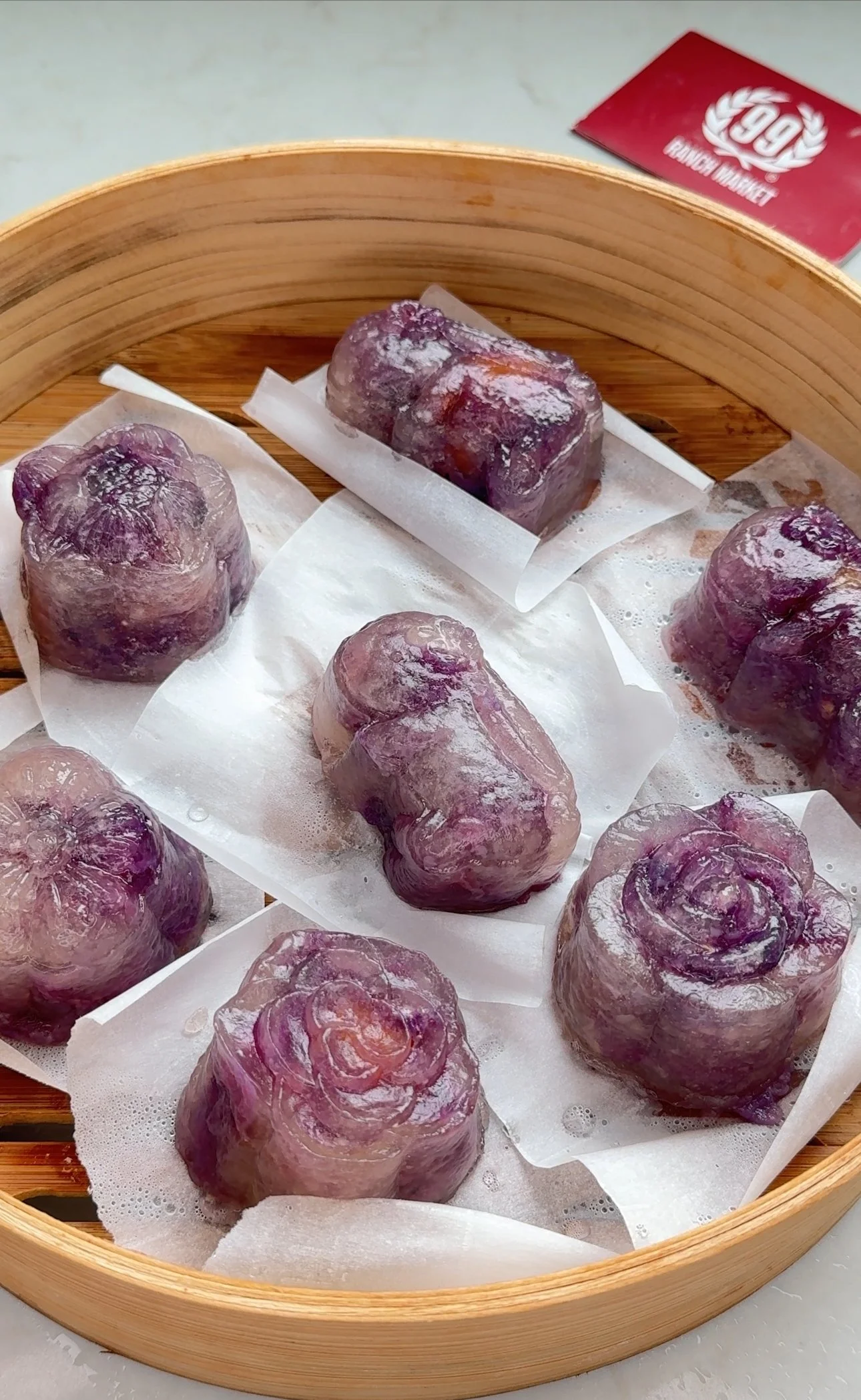 crystal mooncakes laid out in wooden steamer basket