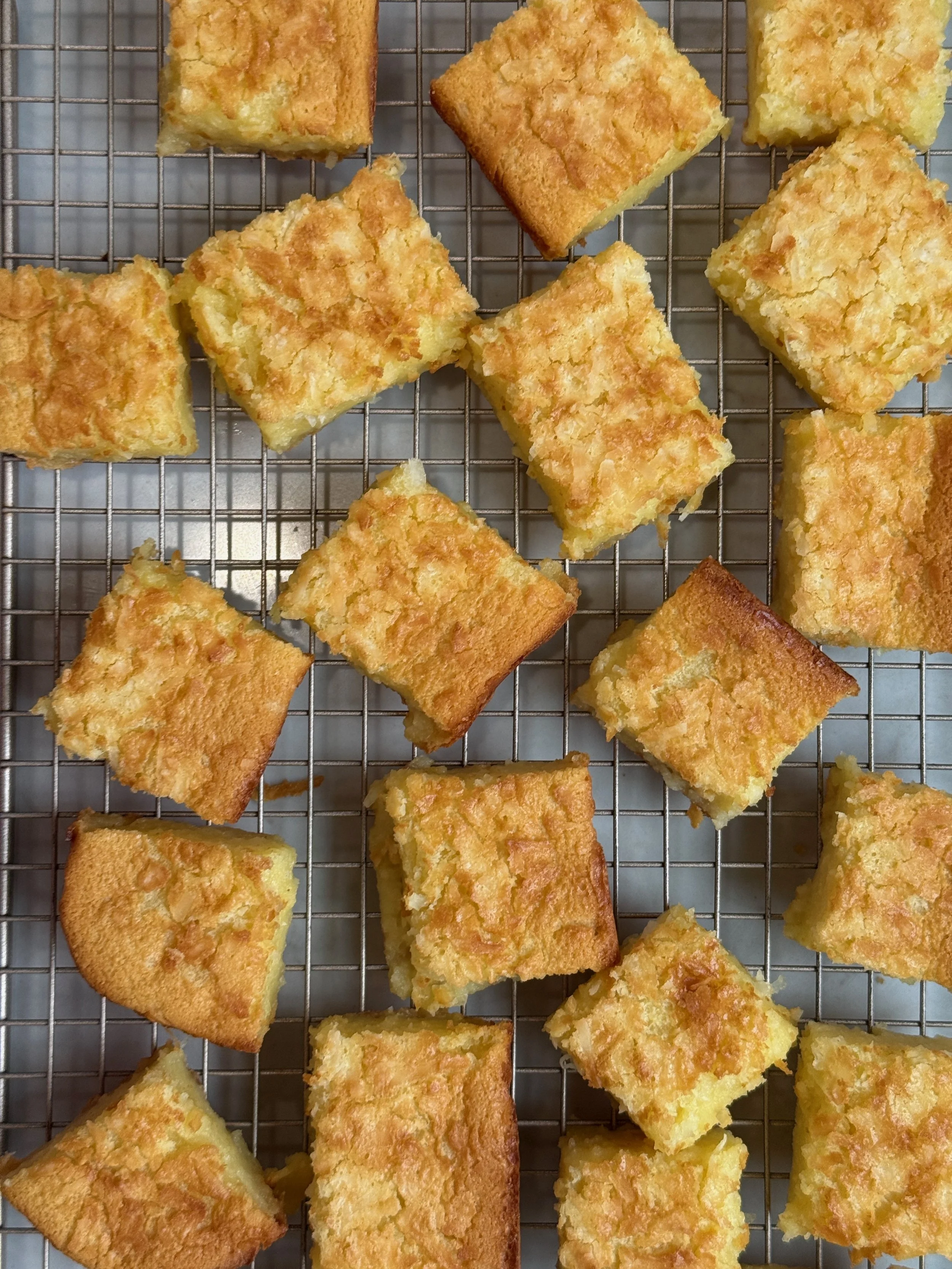 butter mochi laid out on wire rack - top down view