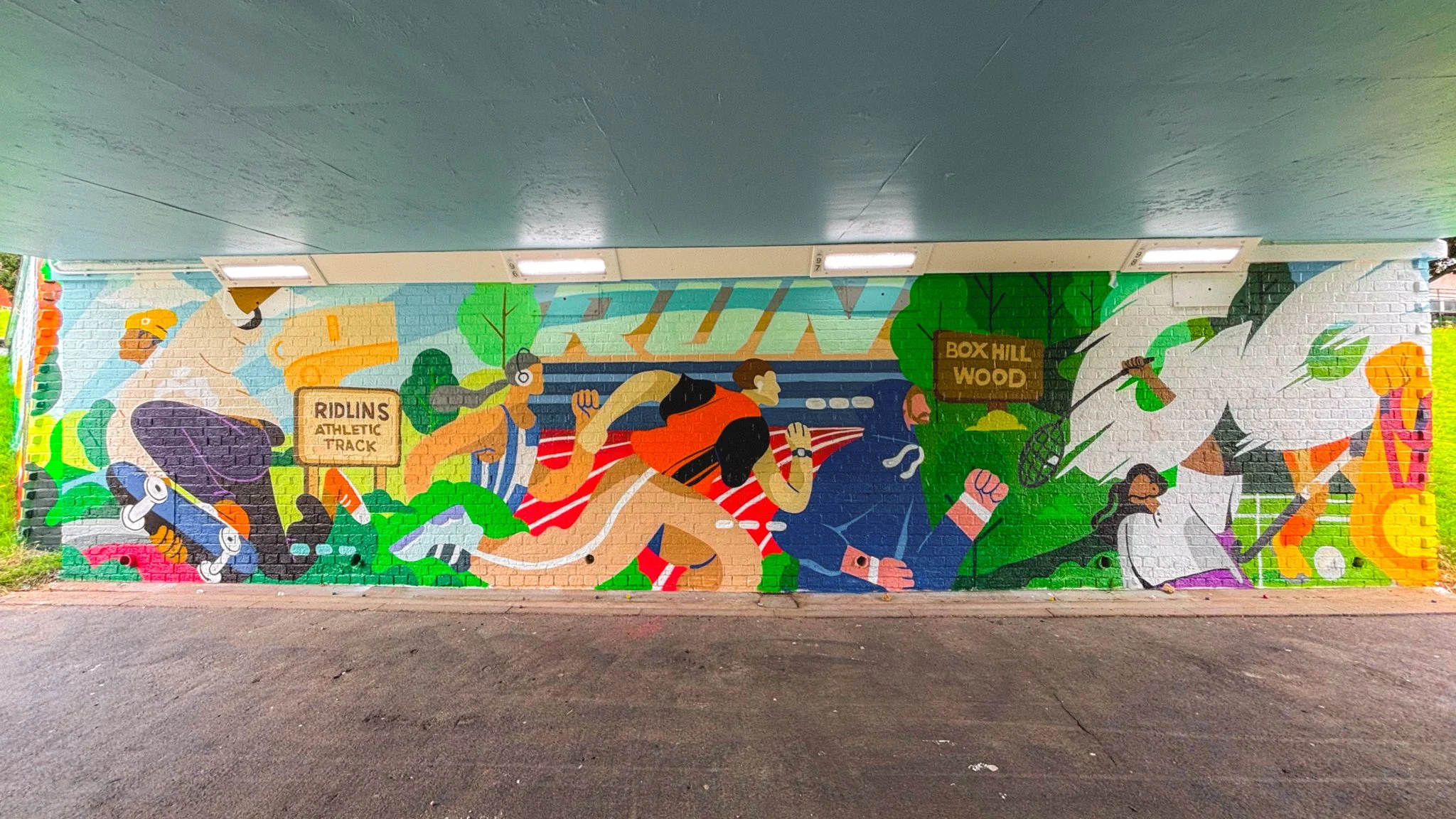 Mural by Mr Christa celebrating play, sport and leisure in Stevenage for Blank Walls public art programme