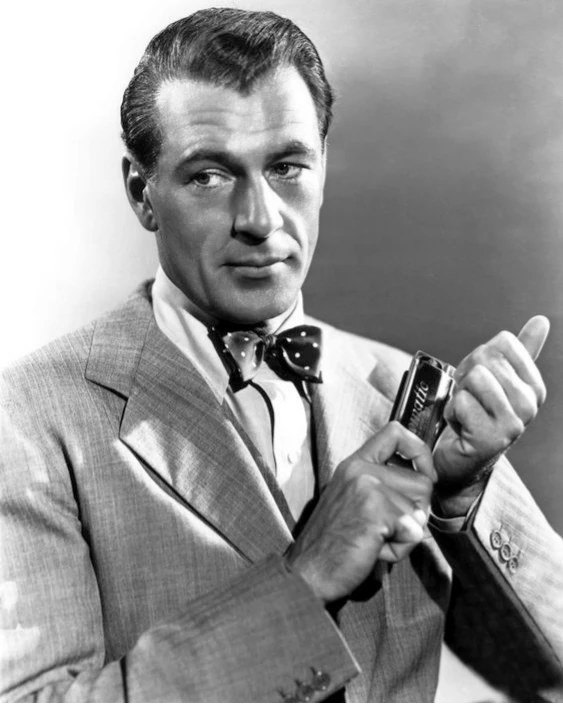 🌟🎥 Dive into the timeless allure of classic Hollywood with today's Headshot Thursday featuring the incomparable Gary Cooper! In this captivating headshot, Cooper exudes effortless charisma and timeless charm as he gazes into the camera with an enig