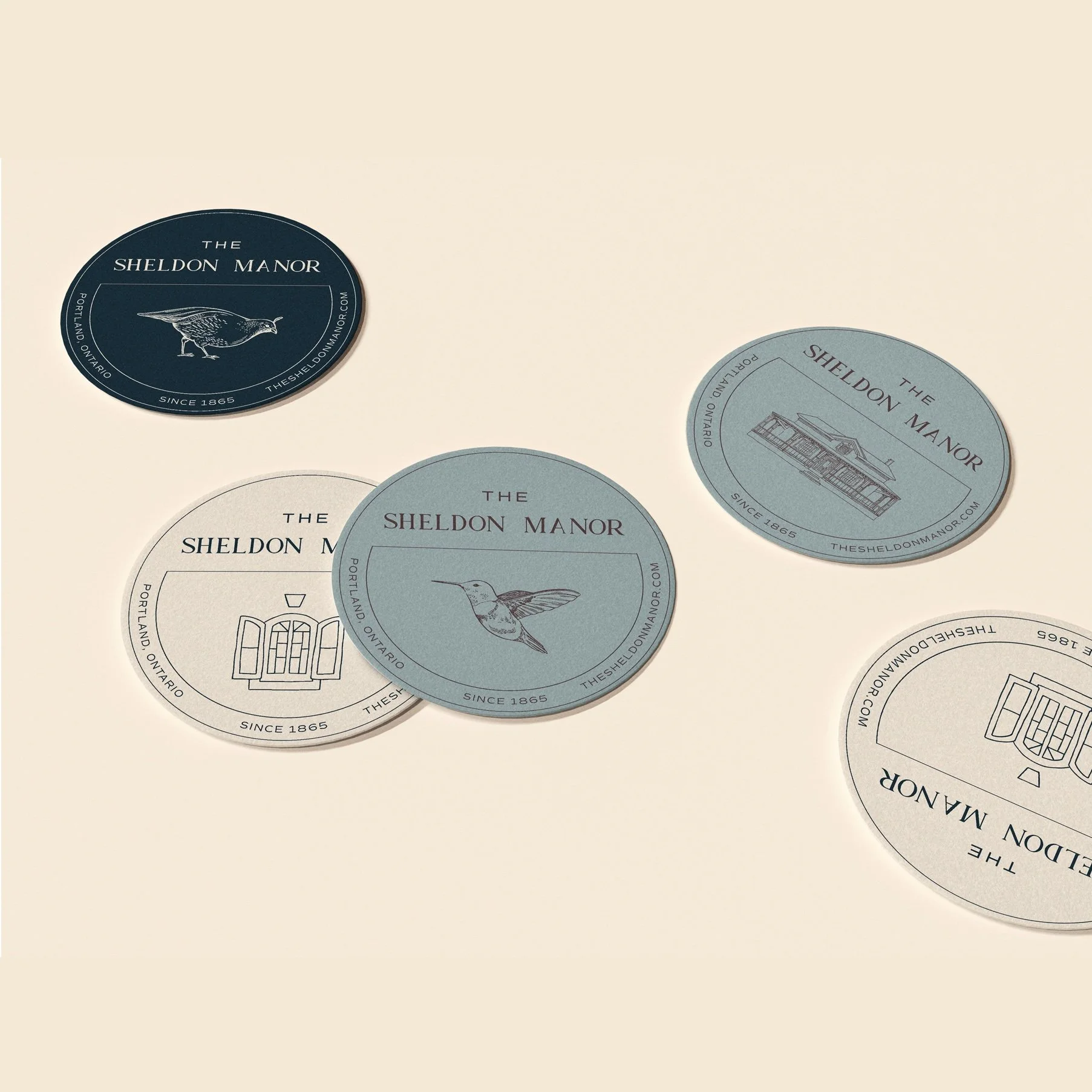 The Sheldon Manor brand identity featuring custom heritage-inspired logos and illustrated property marks