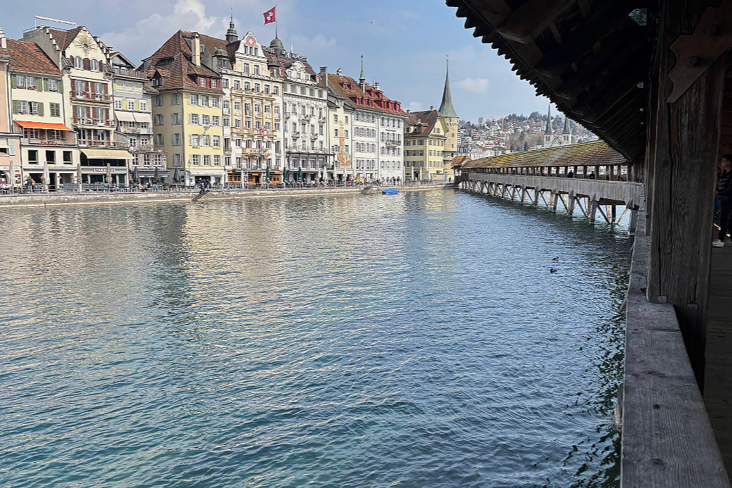View of Chapel Bridge and the Lucerne waterfront during an AM|FM-planned Switzerland family journey.