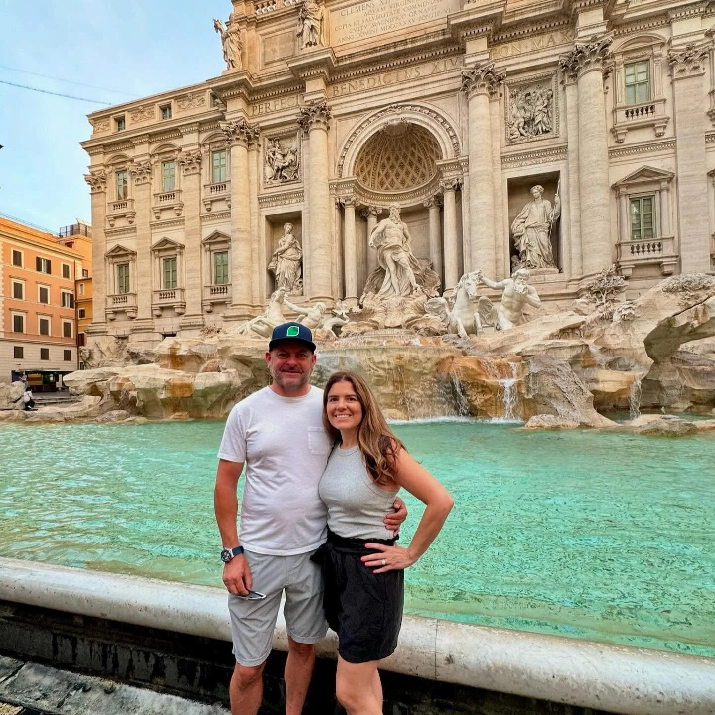 AM|FM Travel clients Jamie and Stacie visiting the Trevi Fountain in Rome during their custom Italy journey.