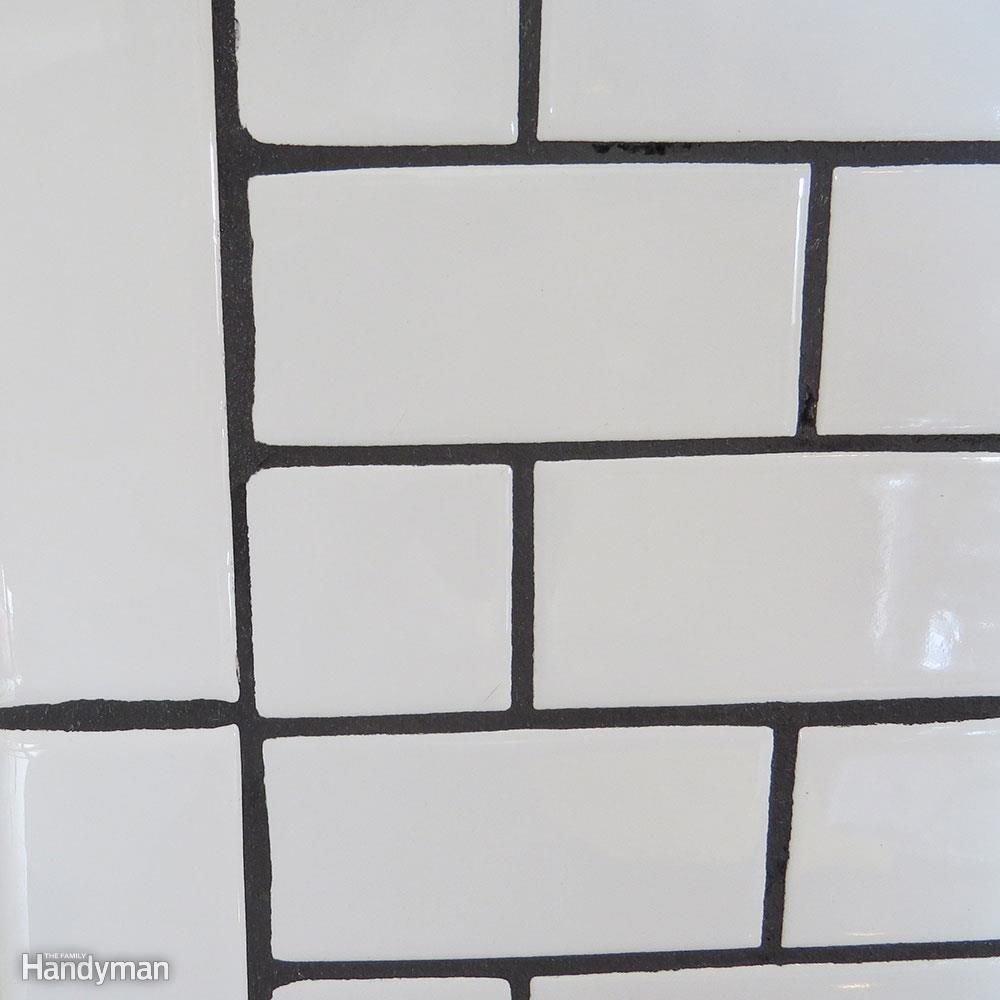Black grout with white subway tile