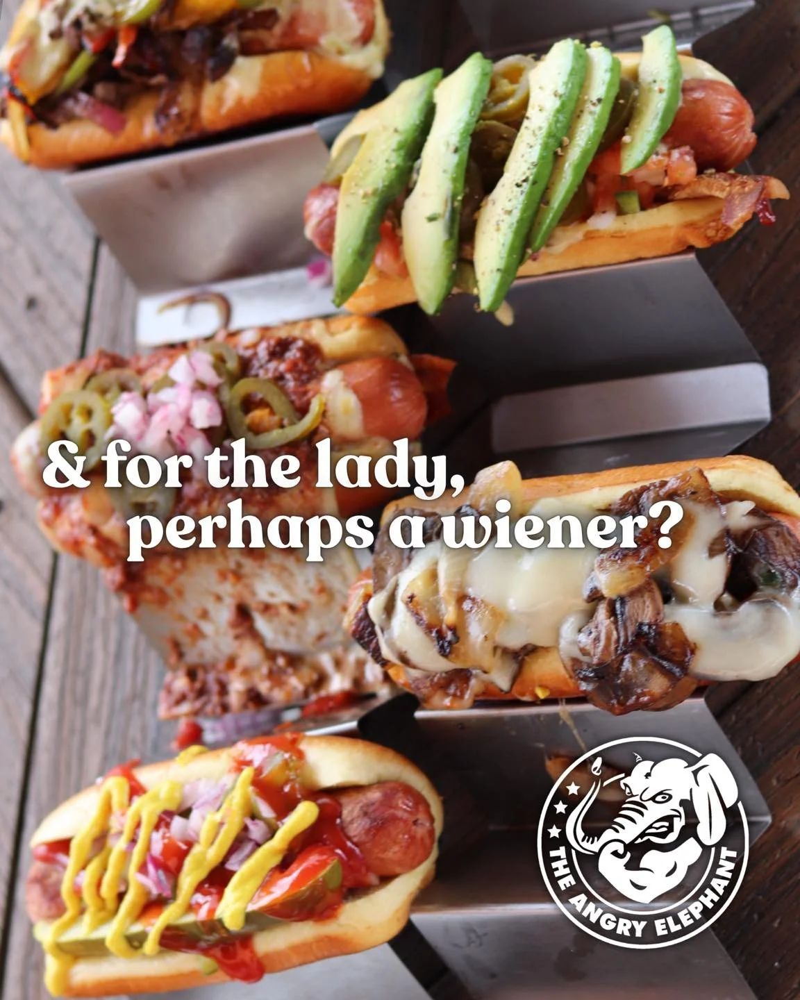 And for the lady,
perhaps a wiener? 🌭

Angry🐘 Elephant has the BEST hotdogs around &mdash; stacked high with flavor and grilled to perfection 🔥
Available in:
🌭 1/4 lb or 🌭 1/2 lb

Come hungry. Leave happy. See y&rsquo;all at The Angry🐘Elephant 