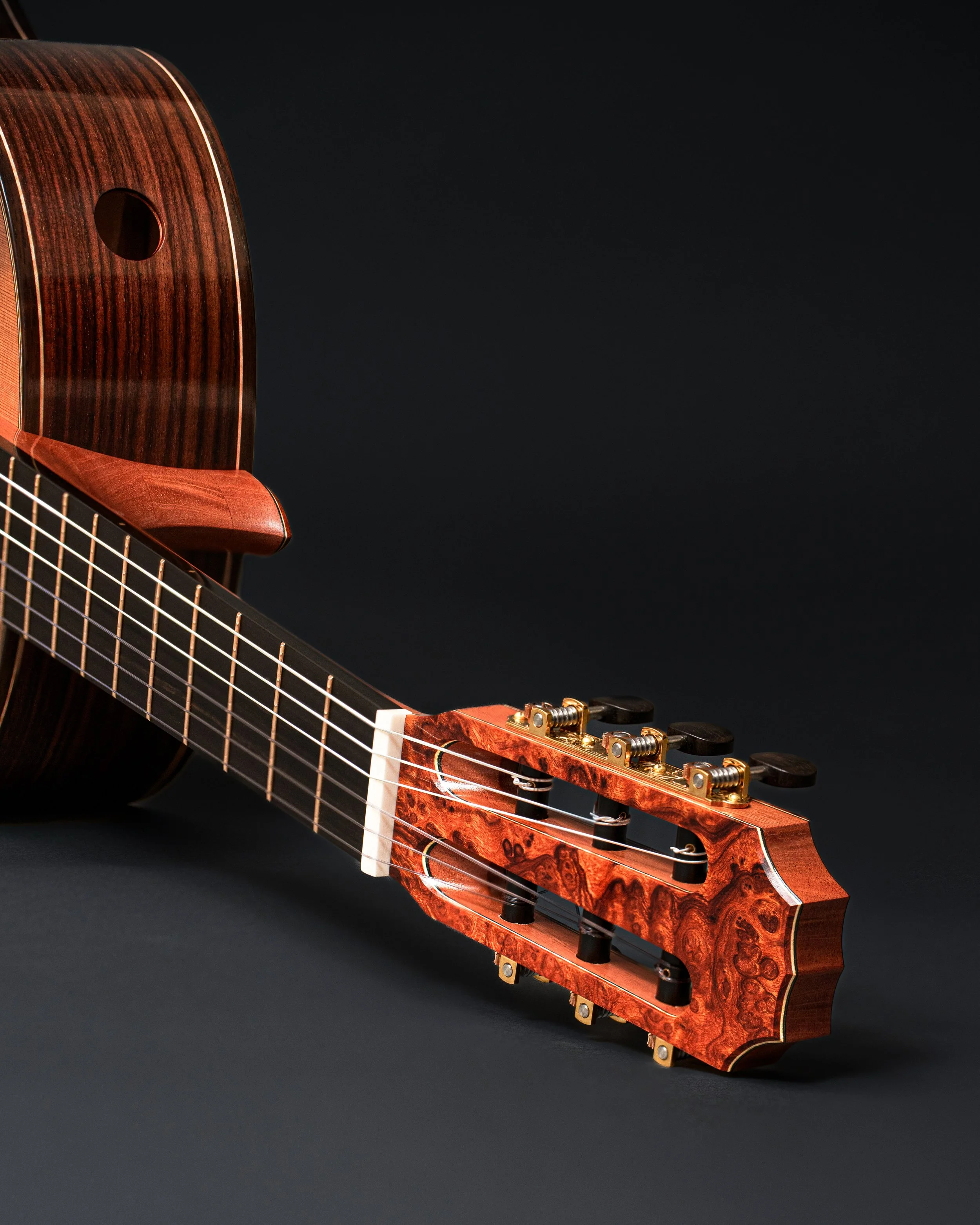 Ironwood Burl headstock on a classical guitar