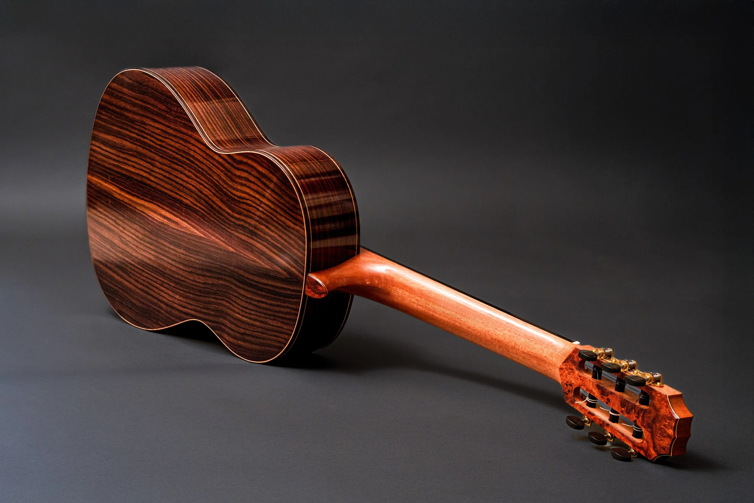 Classical guitar with rosewood back and sides and an Ironwood burl headstock