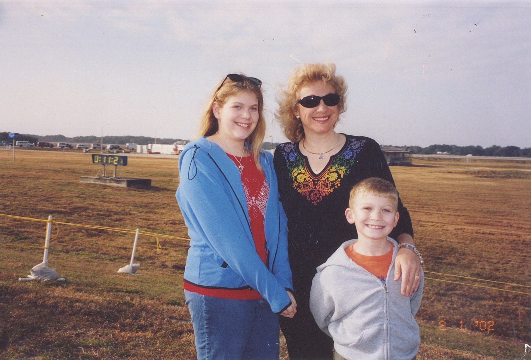 Waiting near the runway for the landing with countdown clock in background on February 1, 2003. Unbeknownst to them the Columbia has already fallen apart.