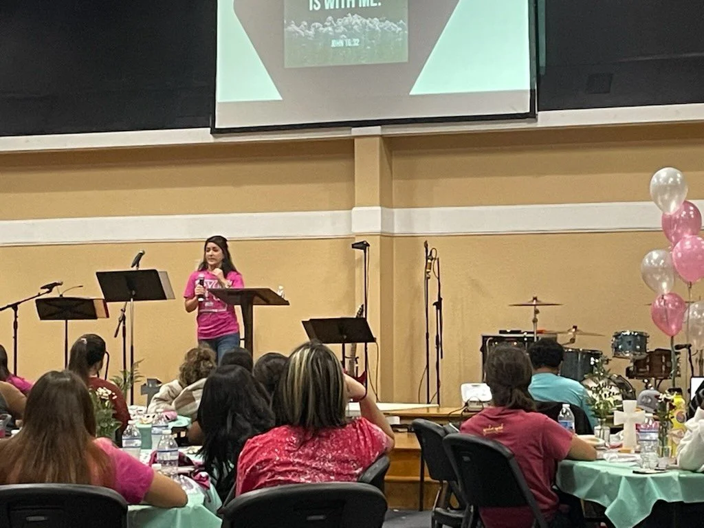 Brittini sharing her testimony at a church retreat
