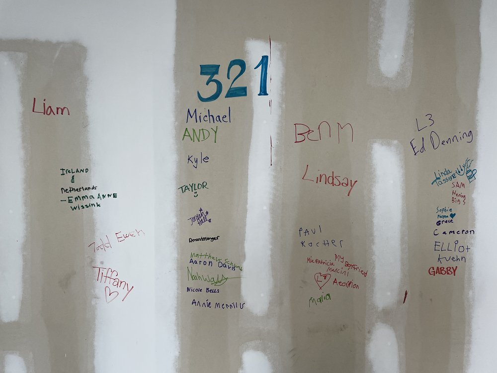 321 Team Signatures on Wall