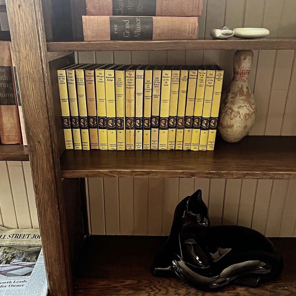 bookshelf-display-vintage-books-haegar-black-cat-bowling-pin.jpg