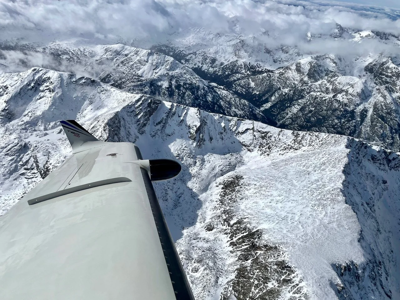 In a holding pattern over the mountains as we await our turn for the approach. Because ASE is a one-way airport, departures and arrivals face each other, requiring more separation that usual. Couple this with heavy traffic and you get delay vectors.