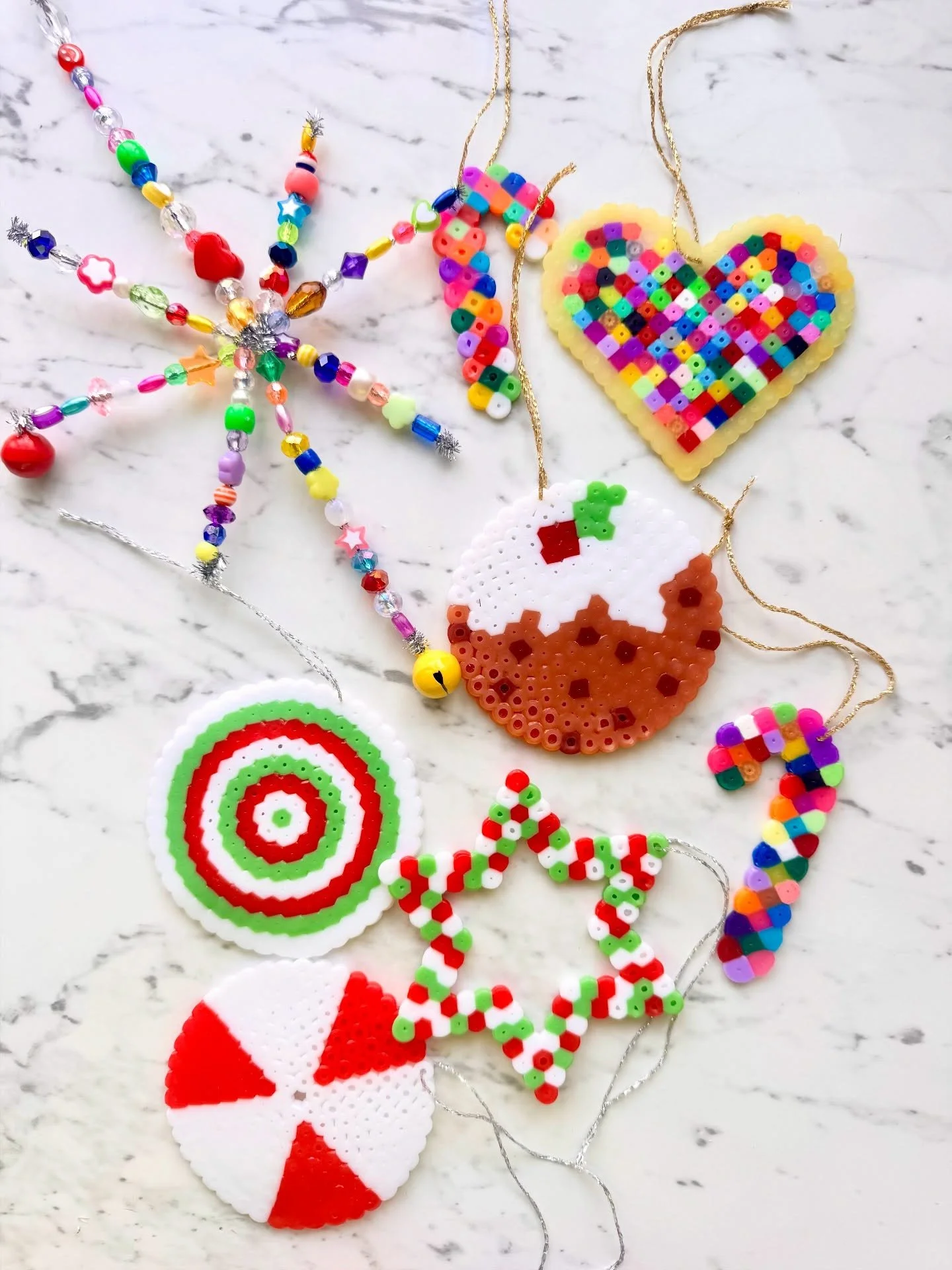 All the fun with iron beads this week in #kirstysartandcraftclub making Christmas decorations. The children were welcome to create anything they wished but Christmas puds were the clear favourites, so much so that I ran out of all shades of brown 🤎