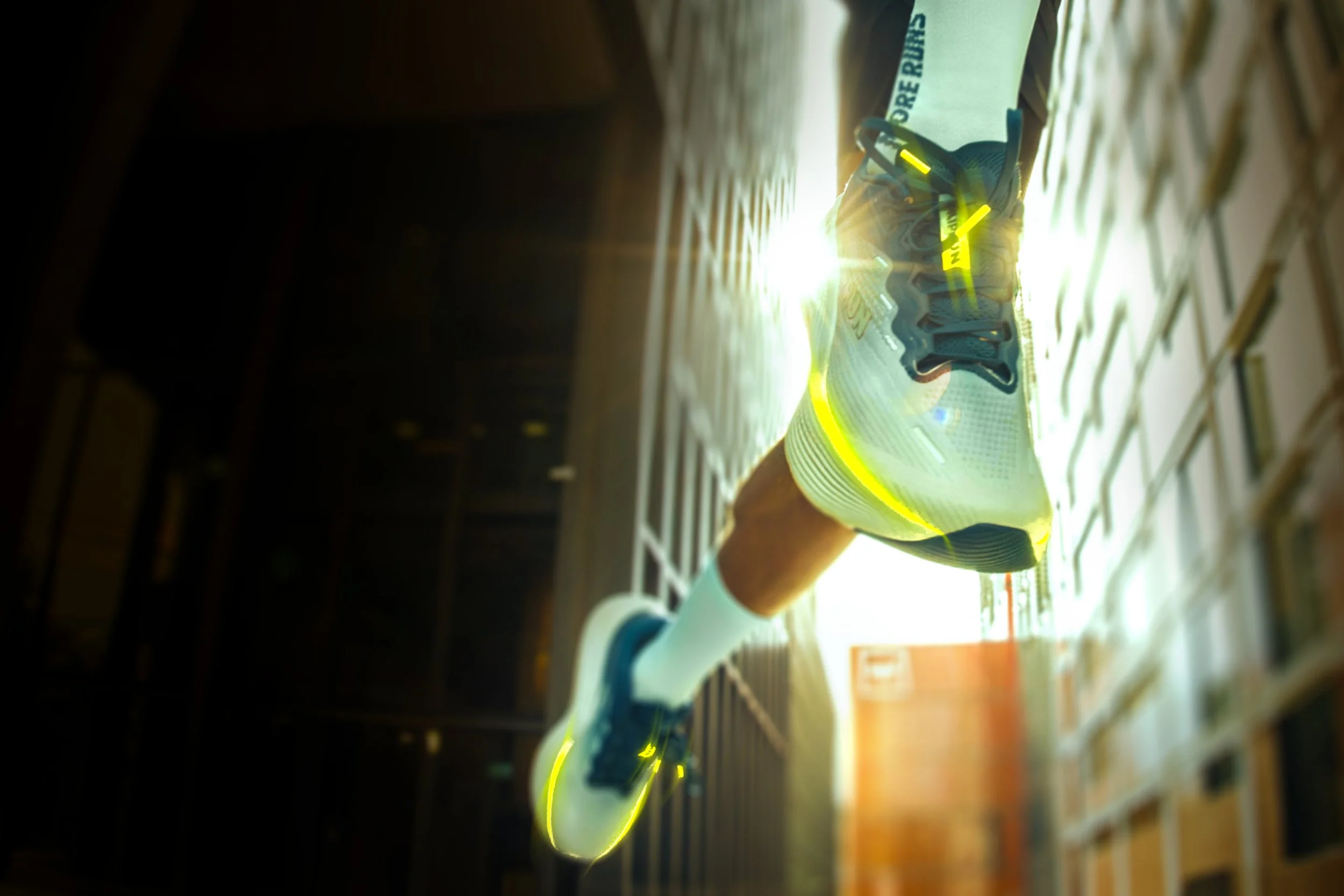 Side view of a running shoe against a bright background.