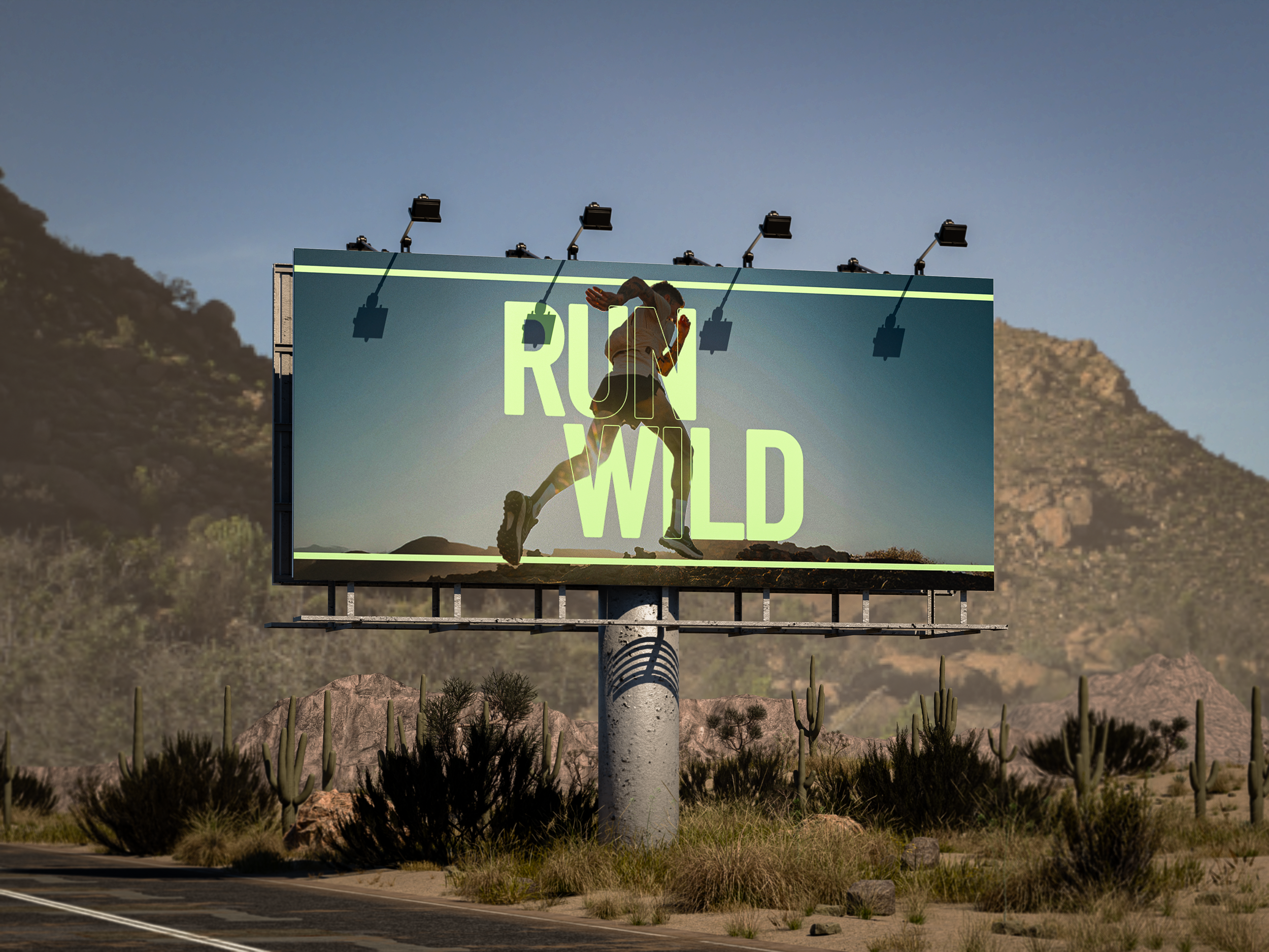 Billboard advertising an adventure race called "Run Wild" with a silhouette of a person running, set against a mountain landscape and a clear blue sky.
