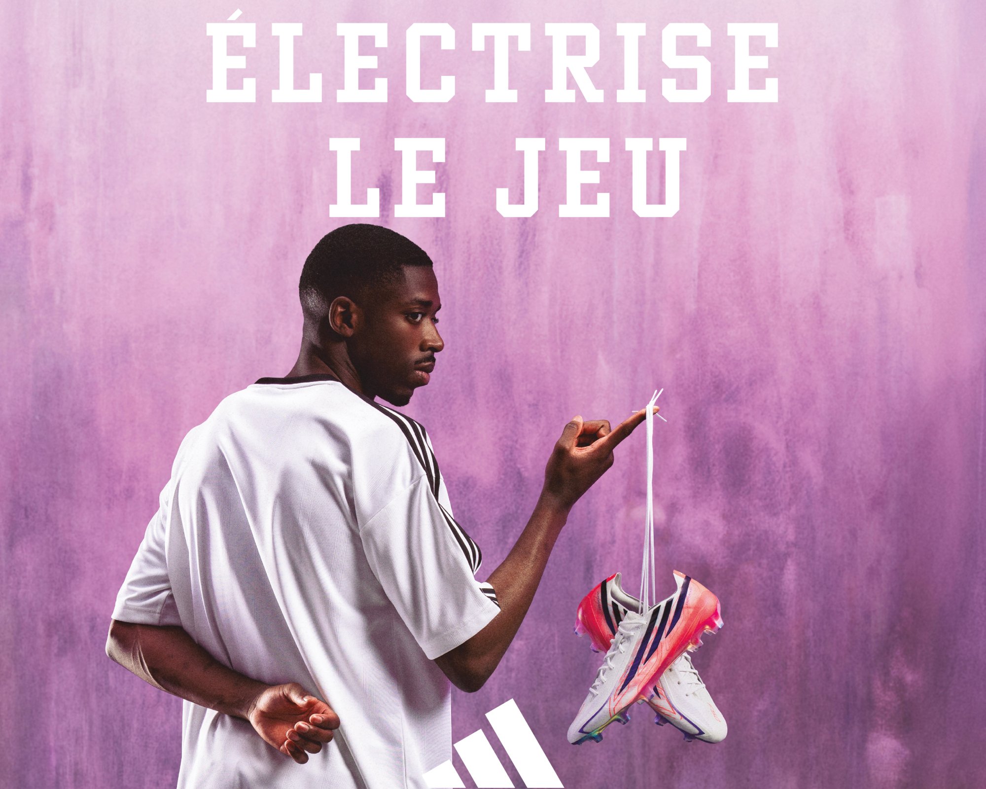 Ousmane Dembélé in a white jersey holding colourful trainers against a purple background, with “ÉLÉCTRISE LE JEU” in white.